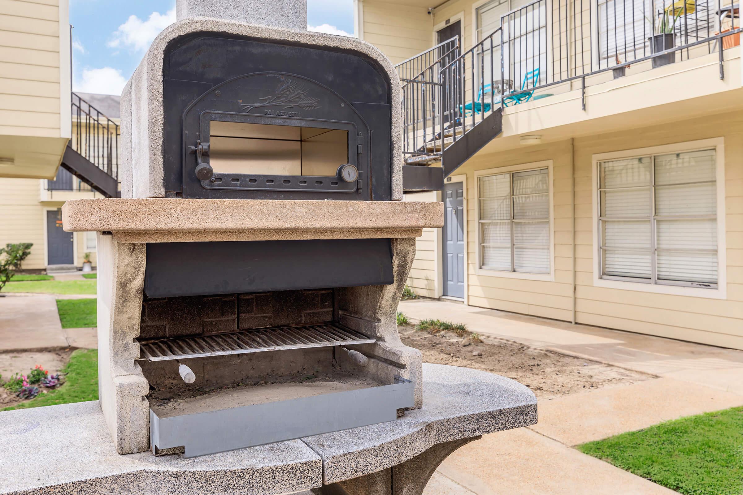 a stone bench in front of a building