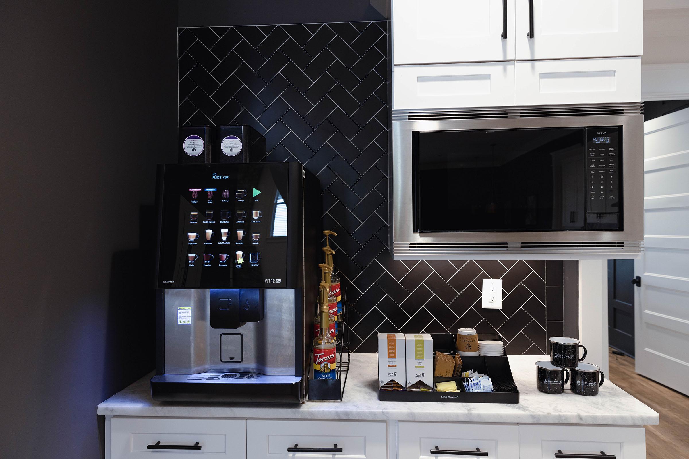 a microwave oven sitting on top of a stove