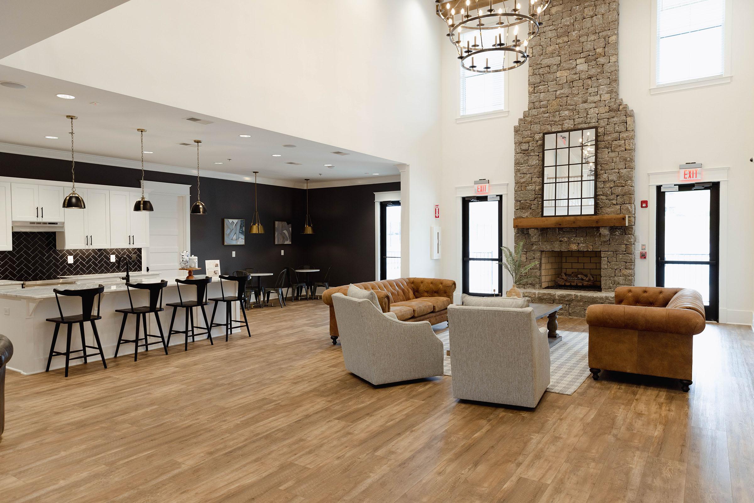 a living room filled with furniture and a large window