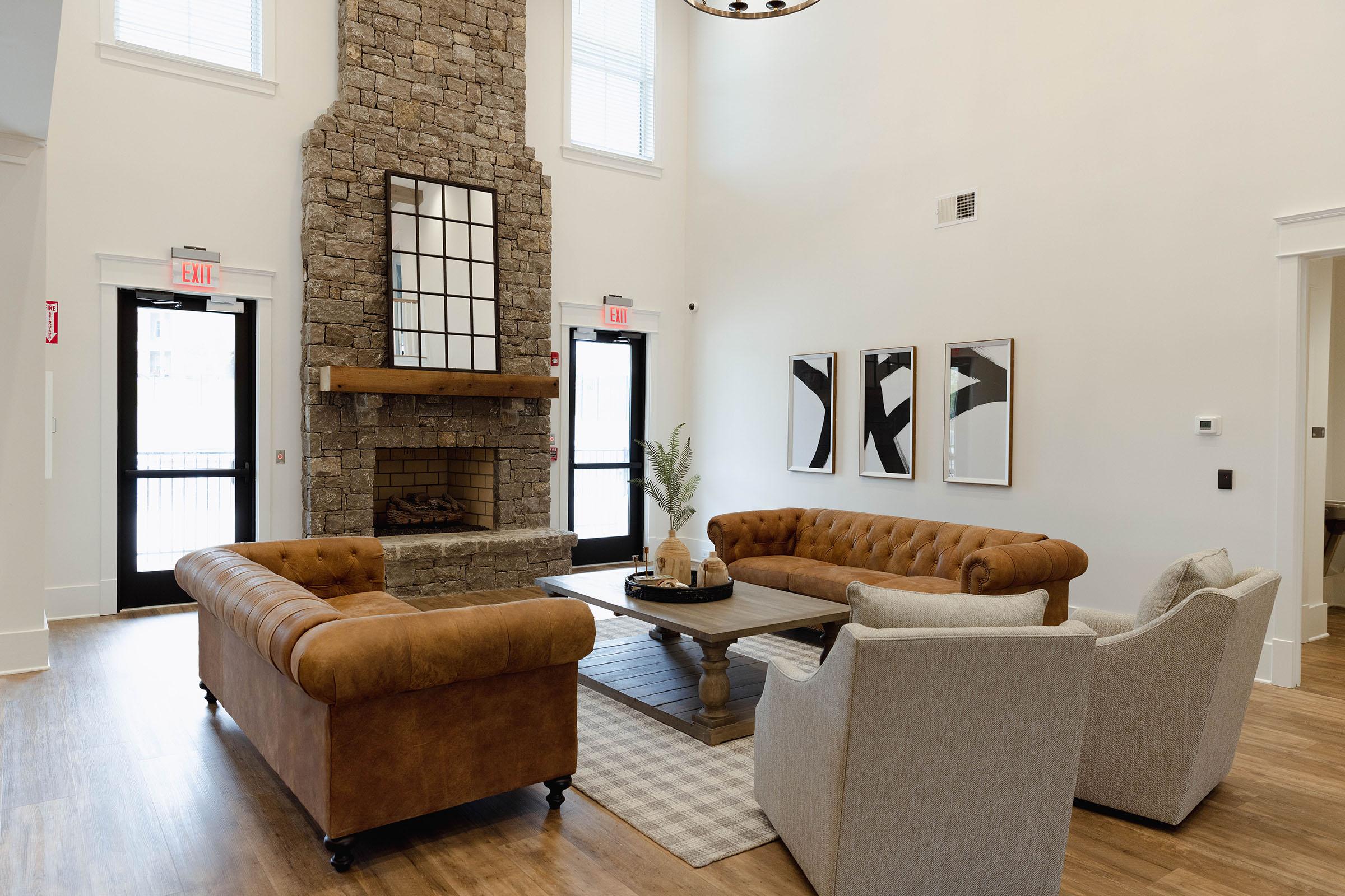 a living room filled with furniture and a fireplace