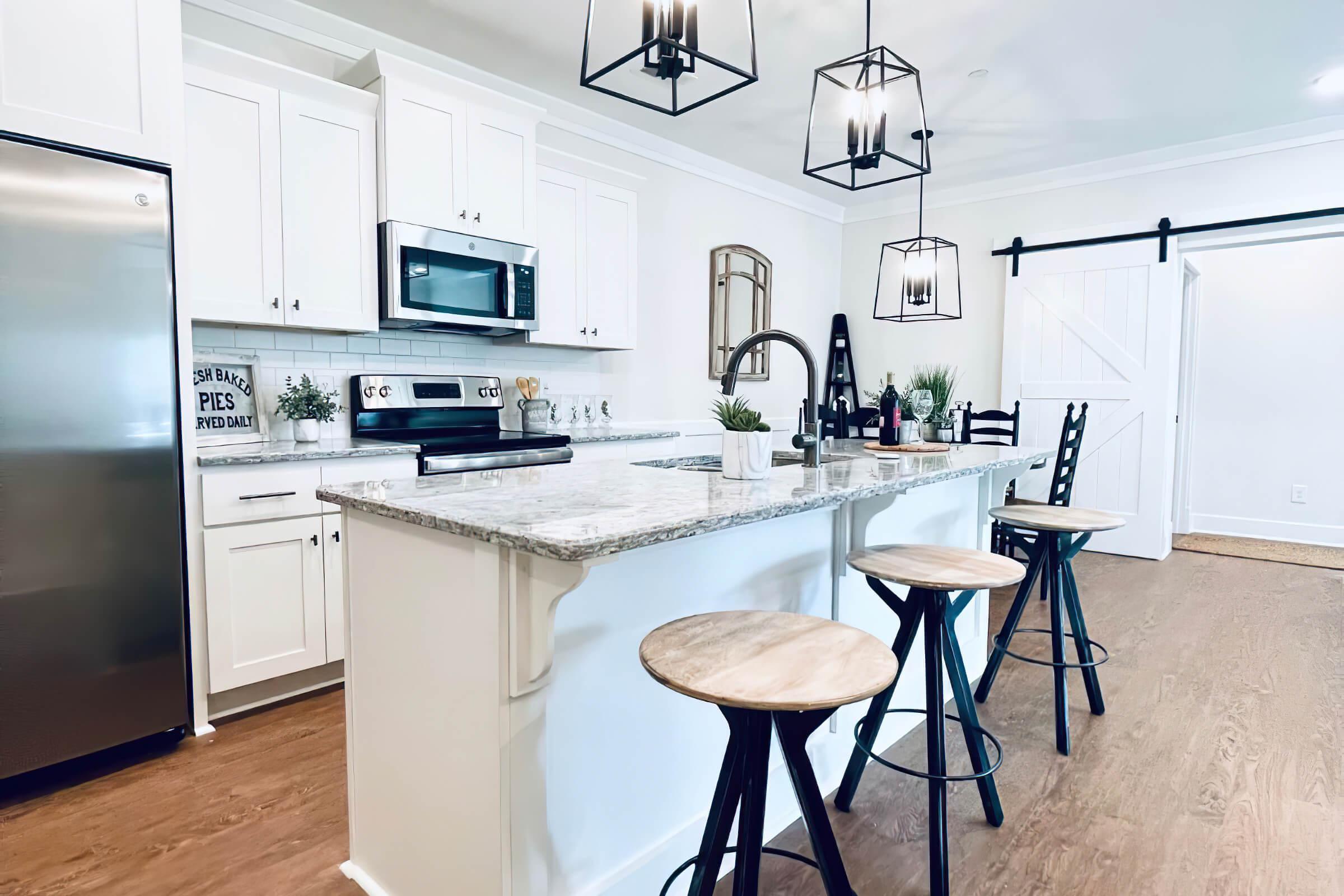 a kitchen with a table and chairs