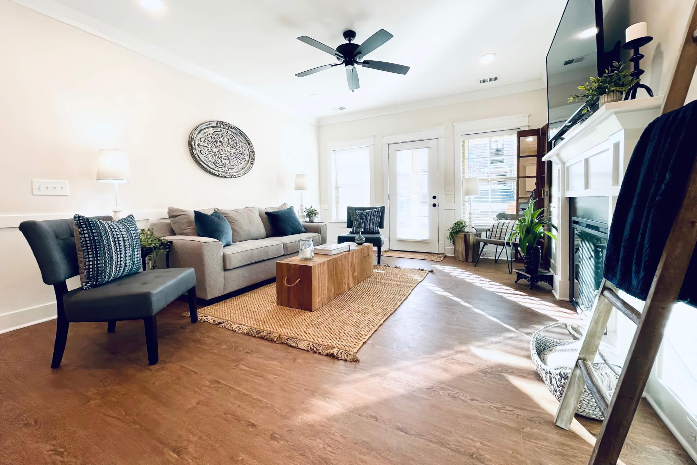 a living room filled with furniture and a fireplace