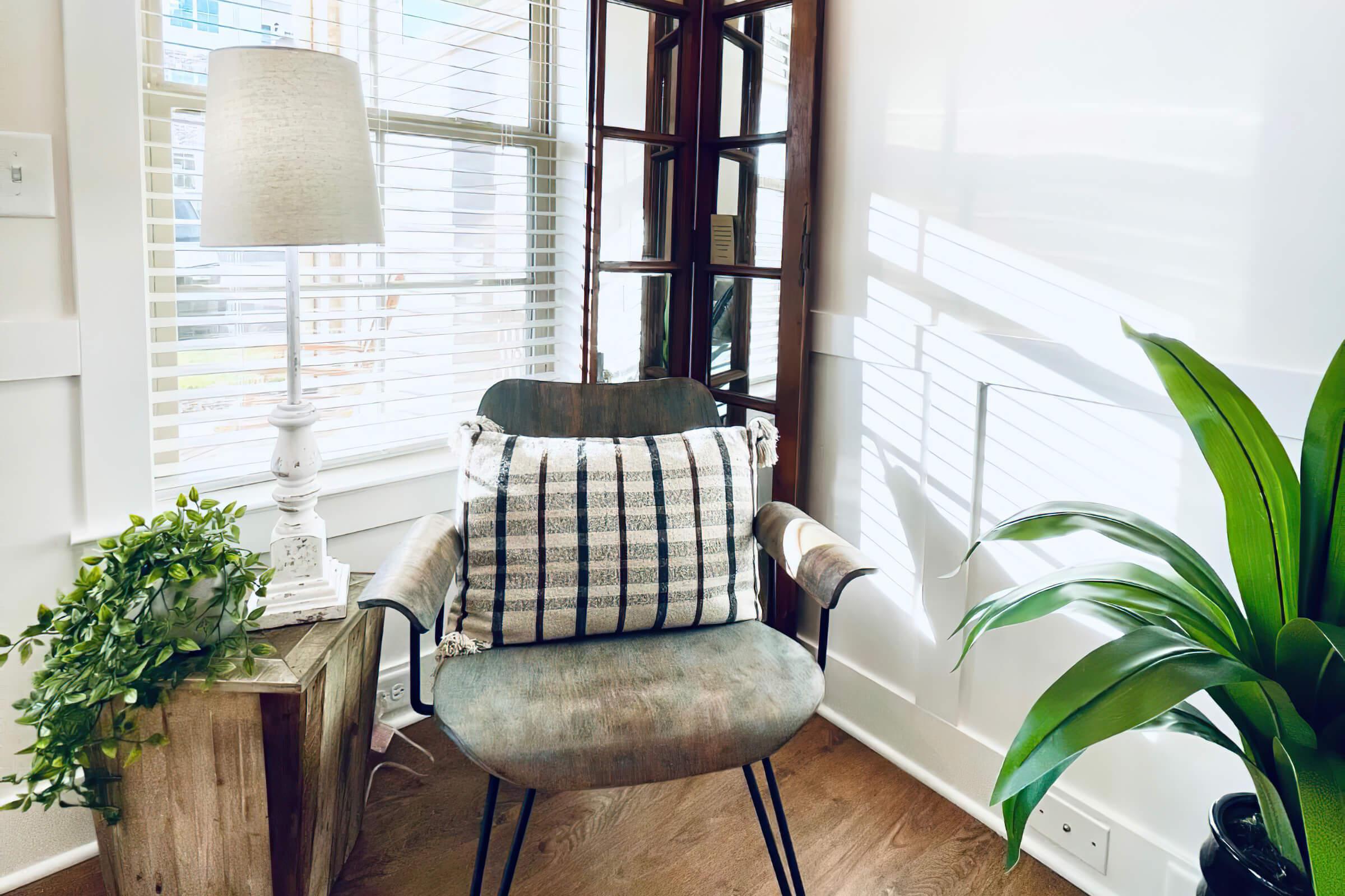 a living room filled with furniture and a large window