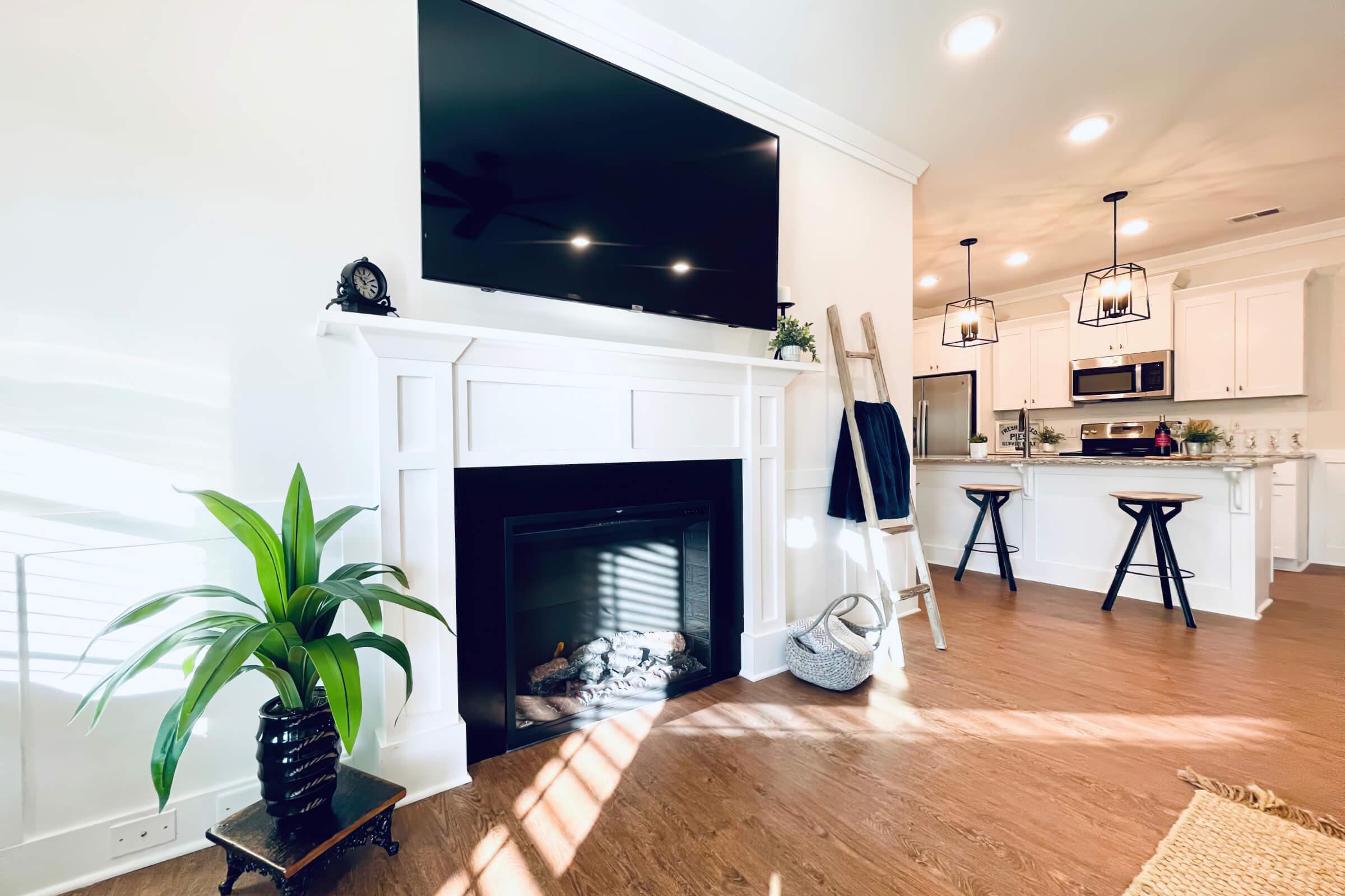 a living room filled with furniture and a fire place