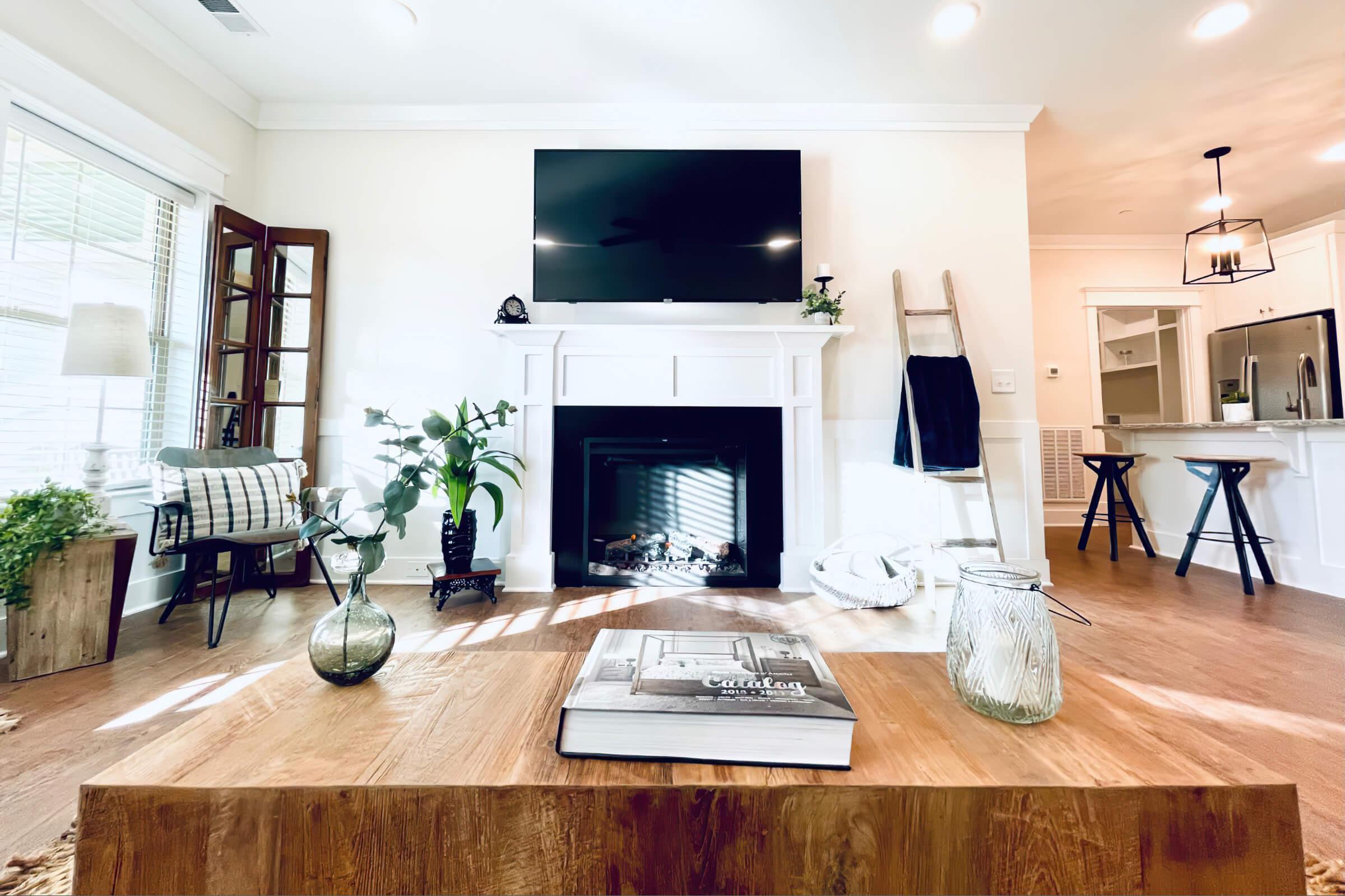 a living room filled with furniture and a fire place