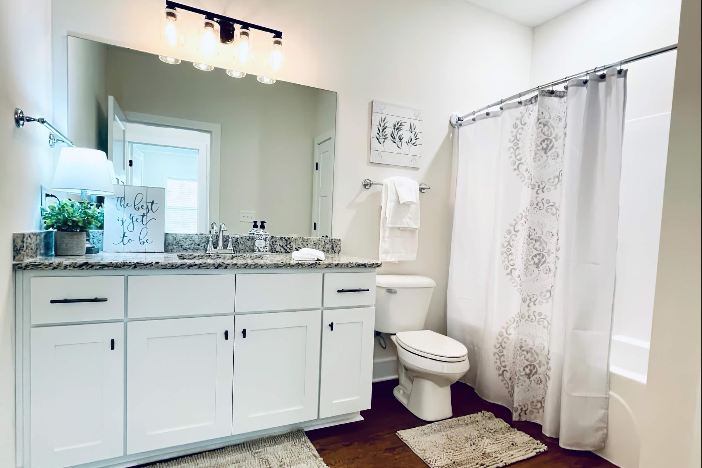 a kitchen with a sink and a mirror