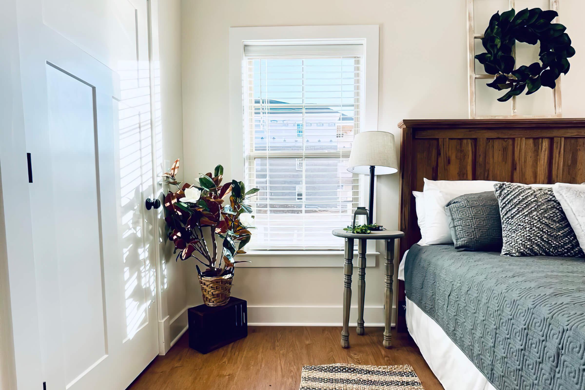 a bedroom with a bed and a couch in a living room