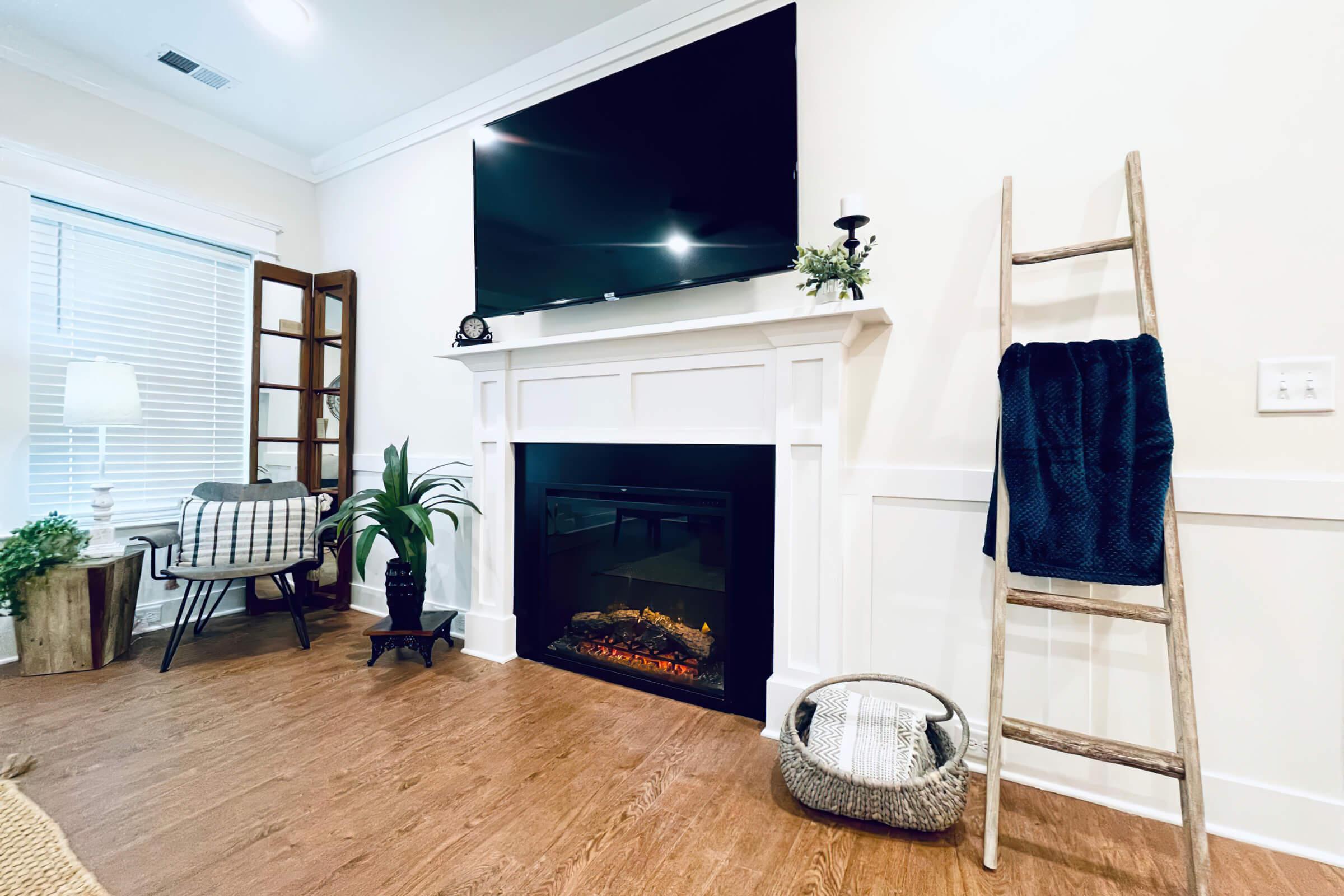 a living room filled with furniture and a fireplace