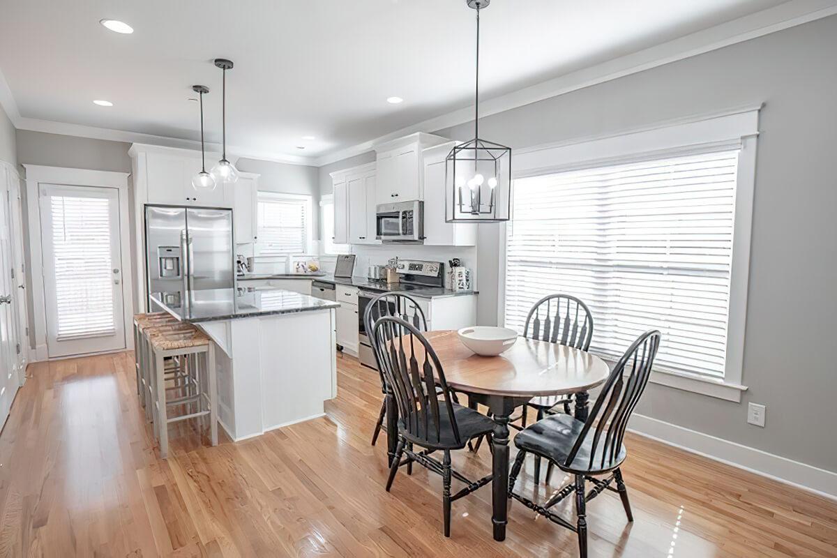 a kitchen with a dining room table