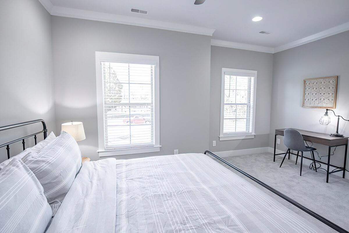 a bedroom with a large bed in a room