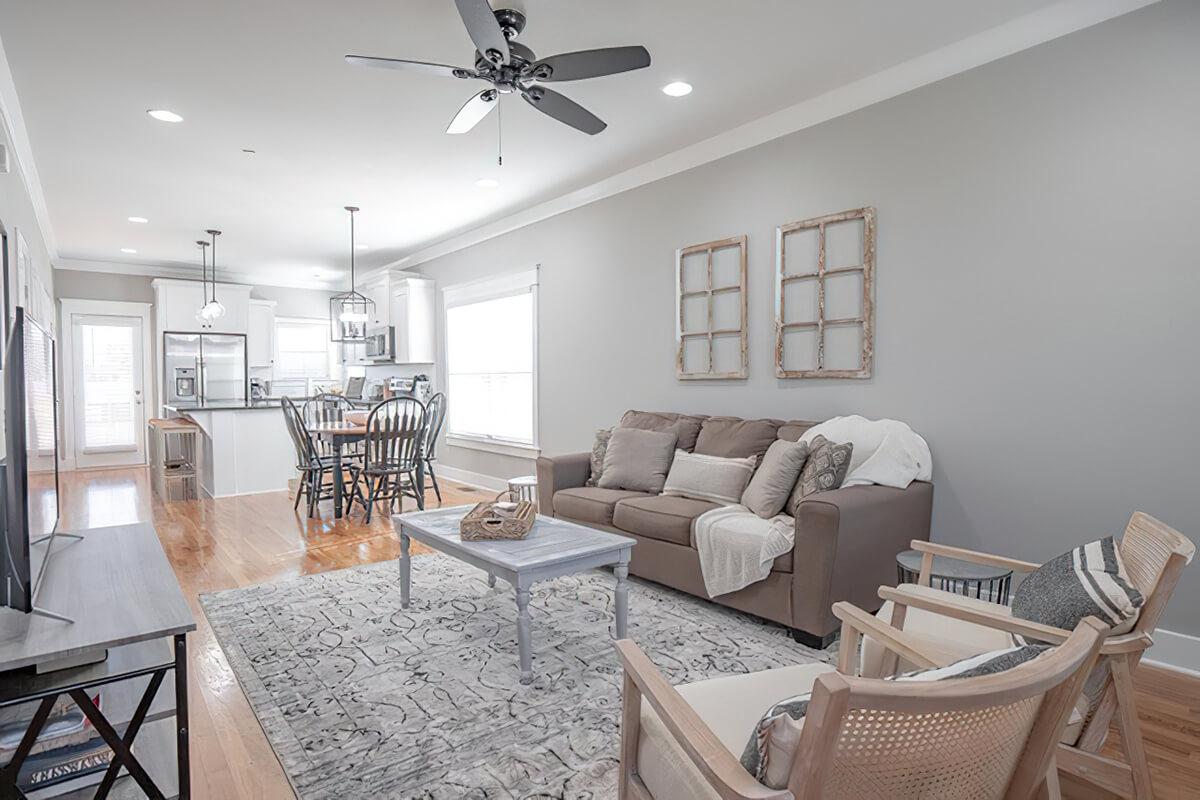 a living room filled with furniture and a table