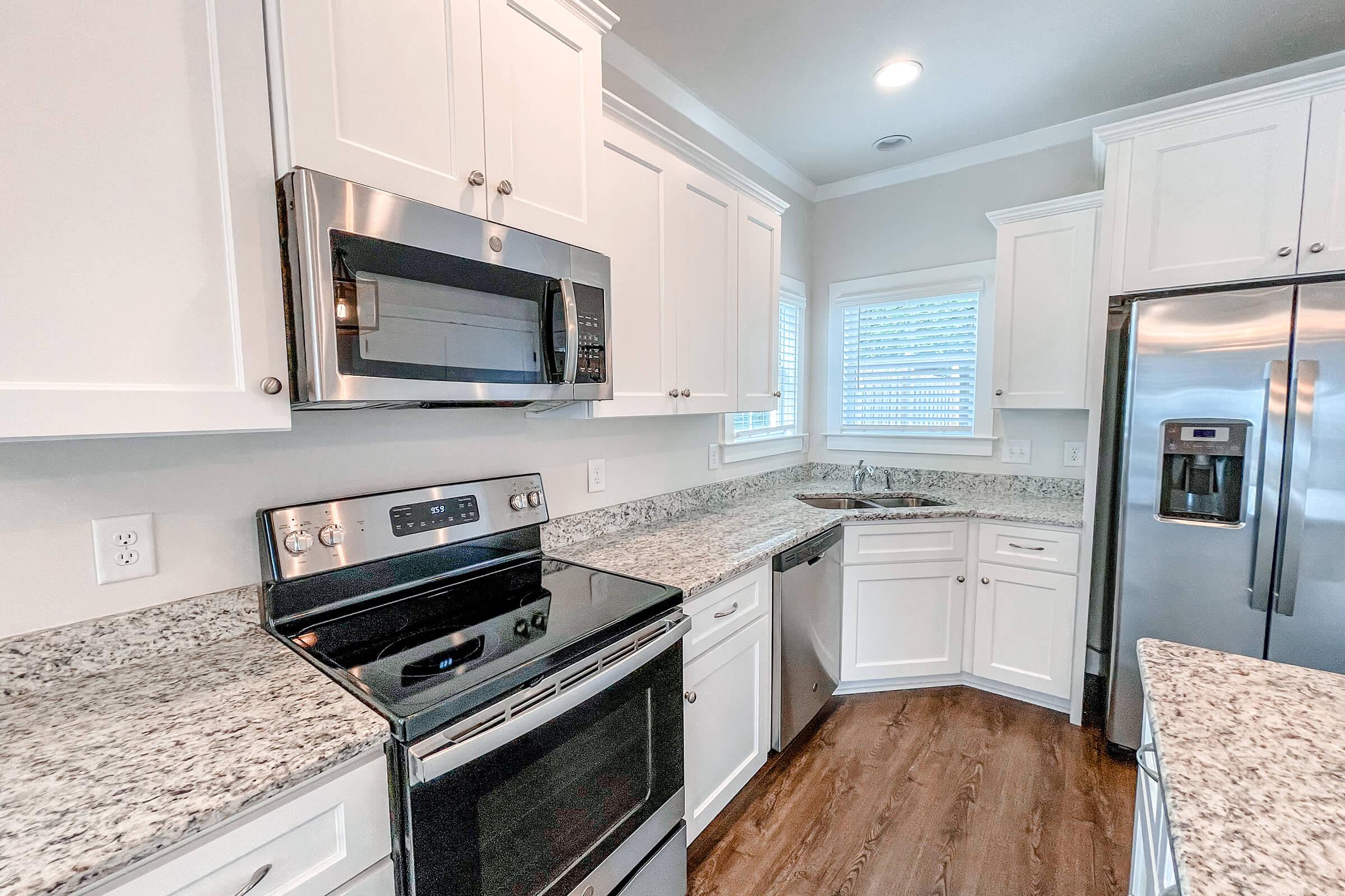 a kitchen with a stove top oven