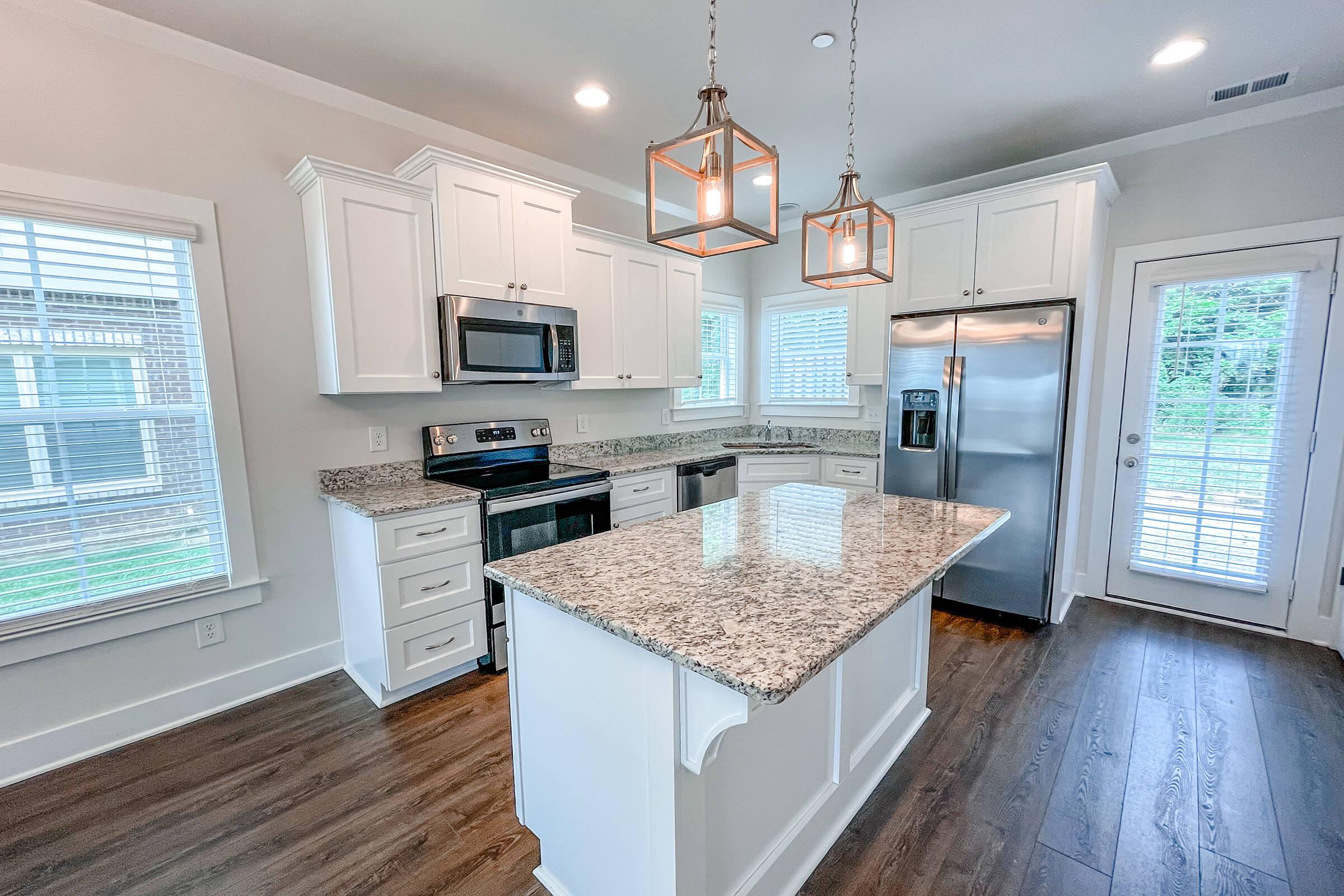 a kitchen with a sink and a window