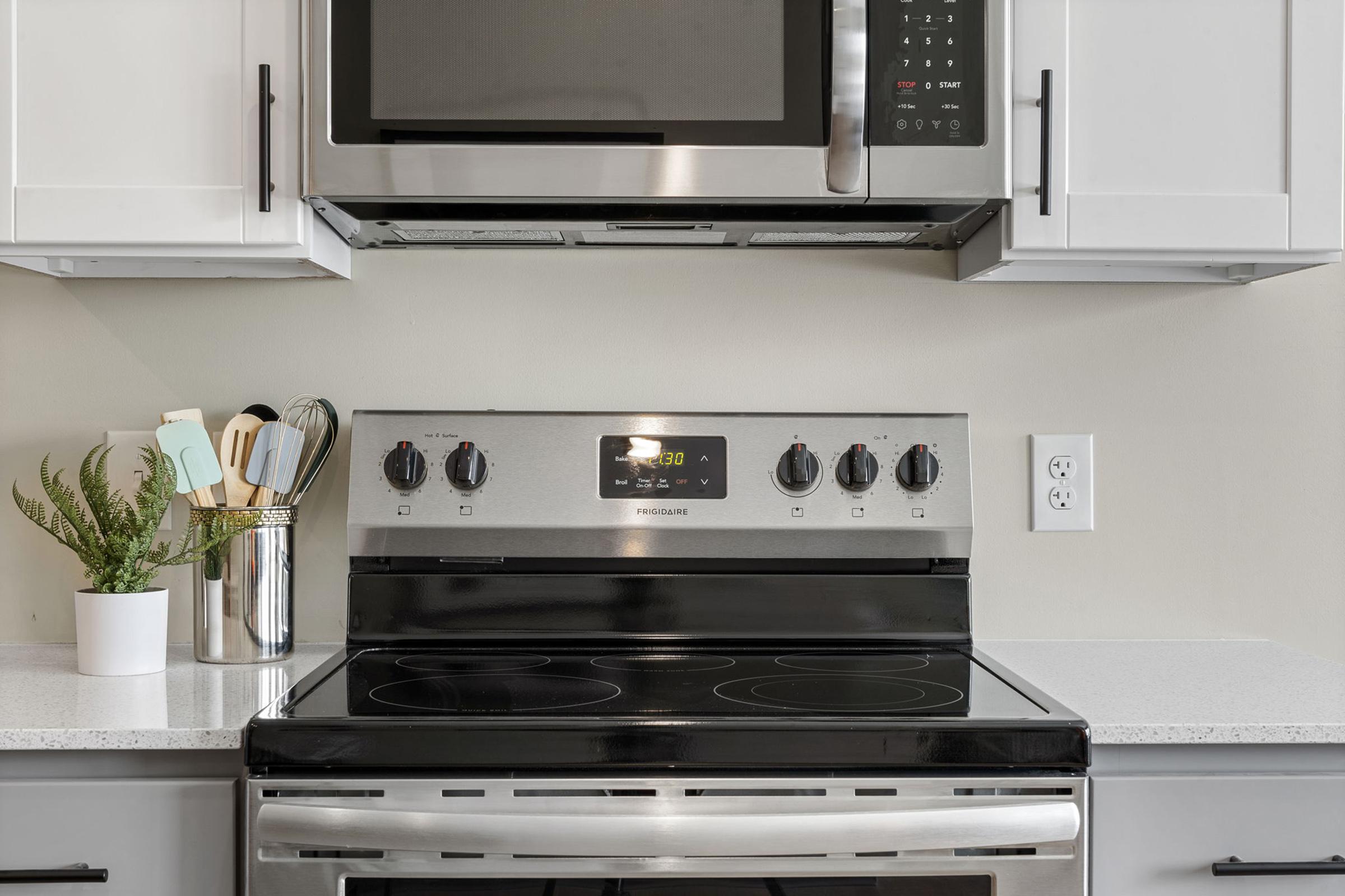 a kitchen with a stove top oven sitting inside of a microwave