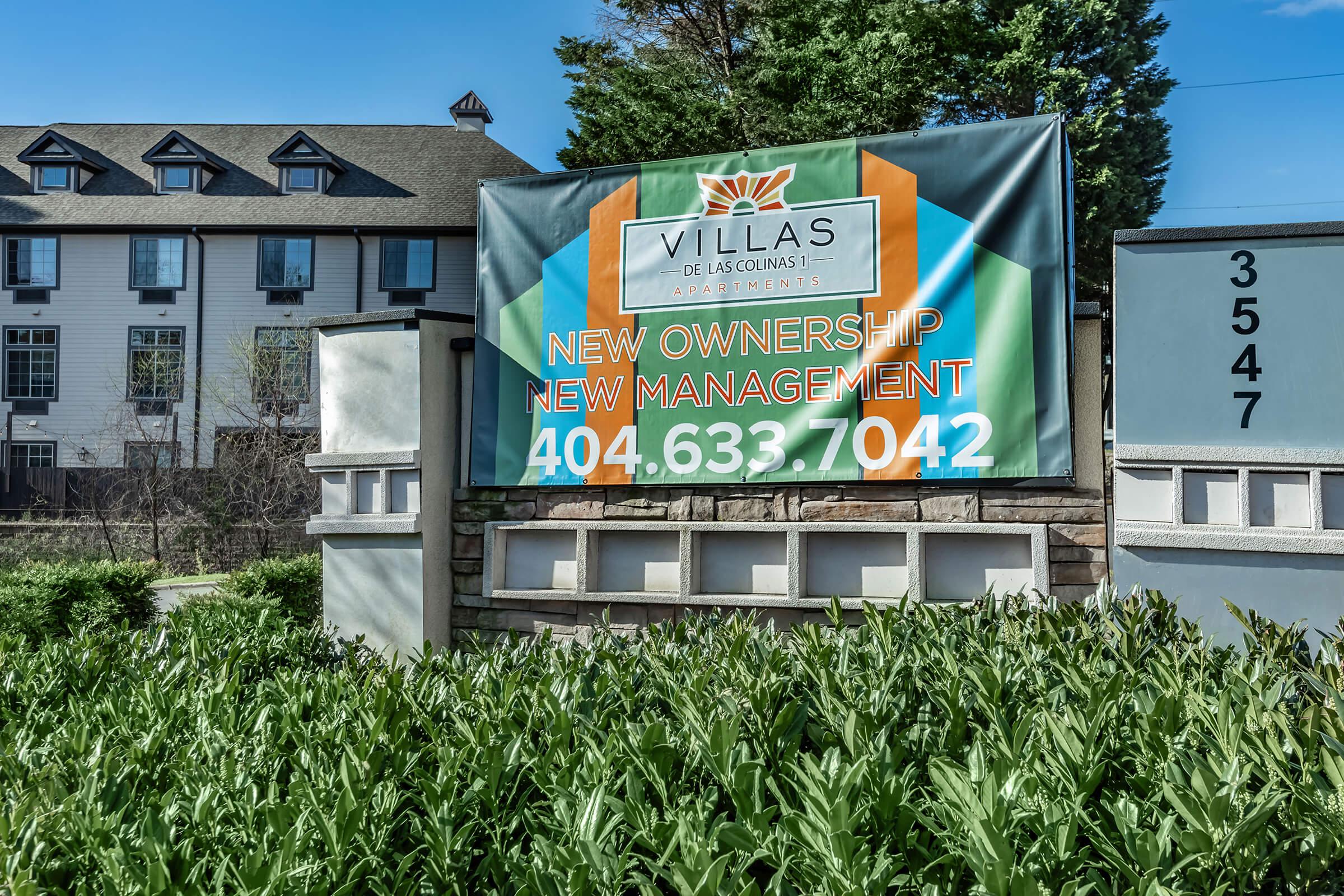 a sign in front of a building