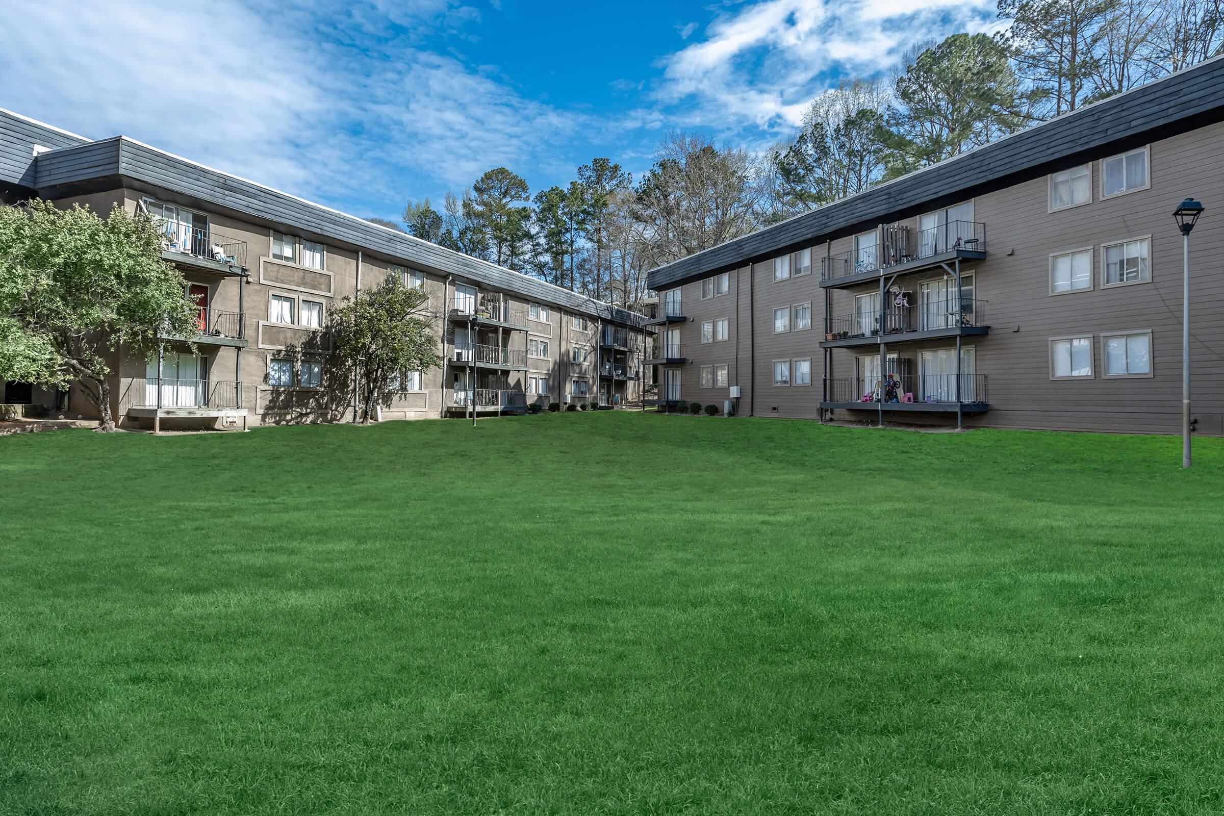 a building with a grassy field