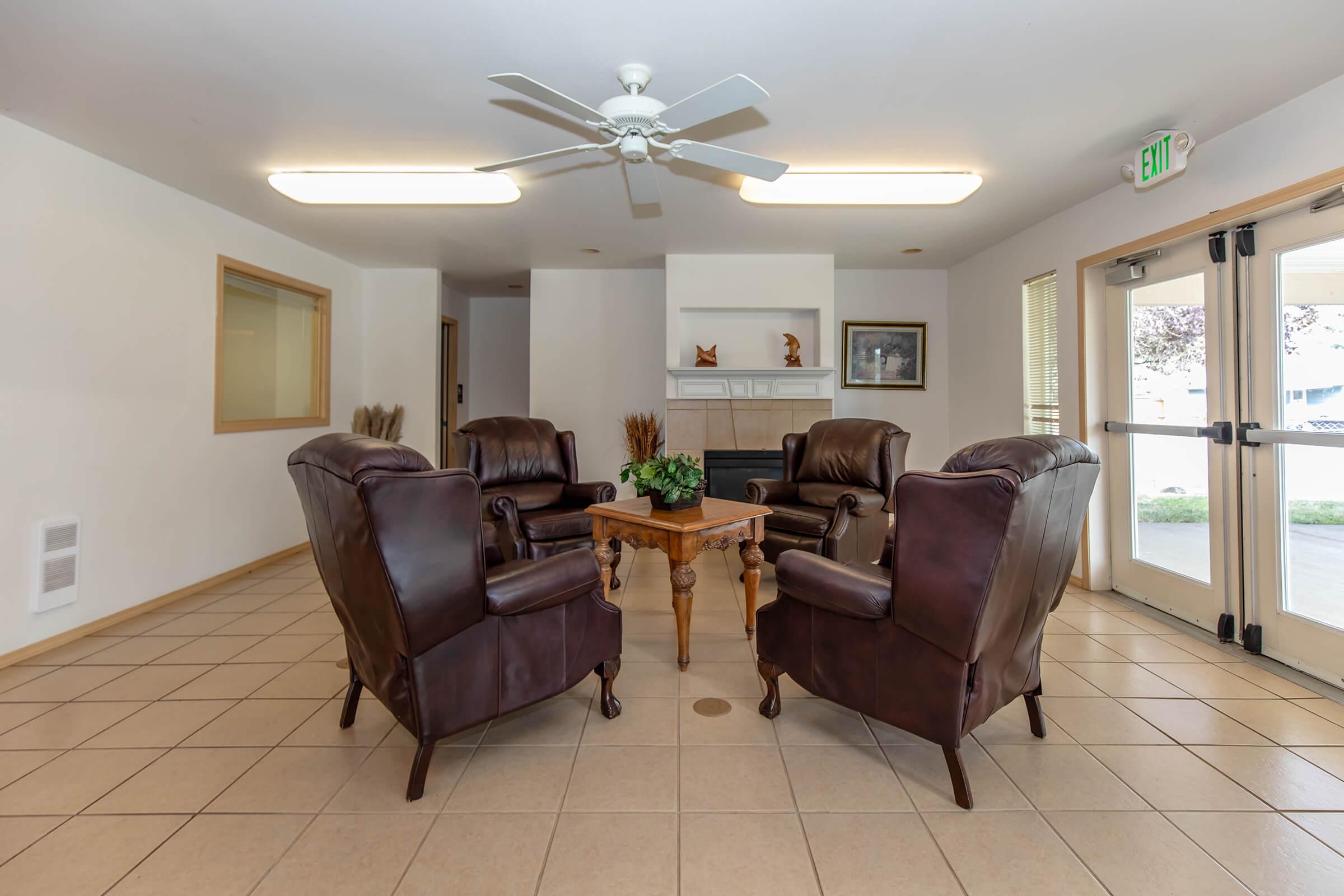 a living room filled with furniture and a large window