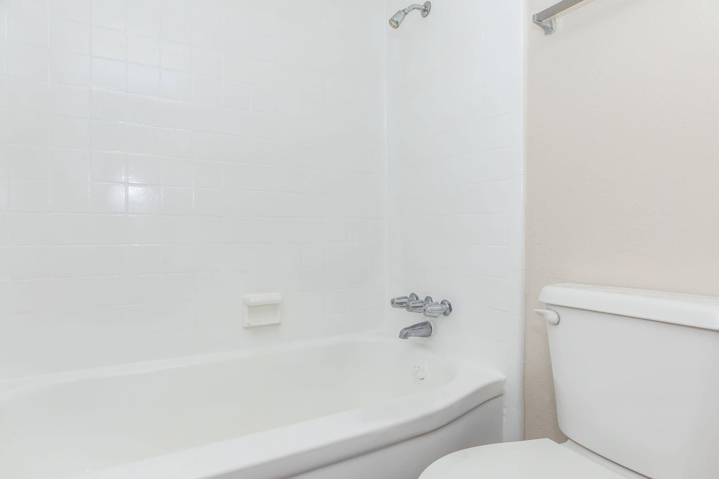 a close up of a sink and a bath tub