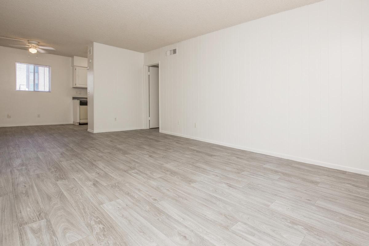 a large empty room with a wooden floor