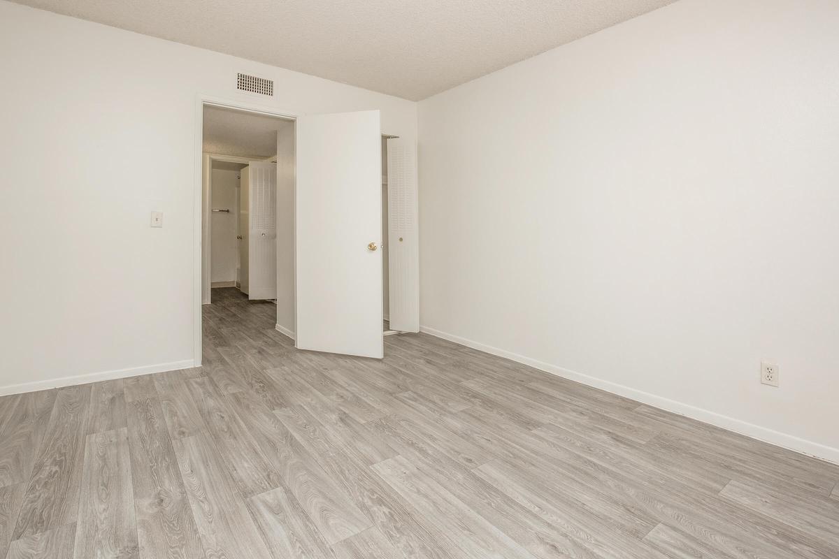 a large white building with a wooden floor