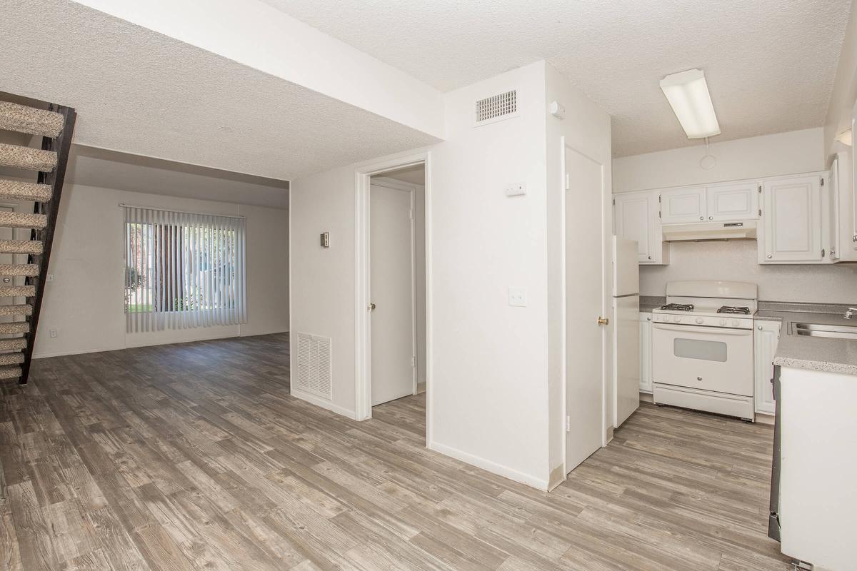 a kitchen with a wood floor