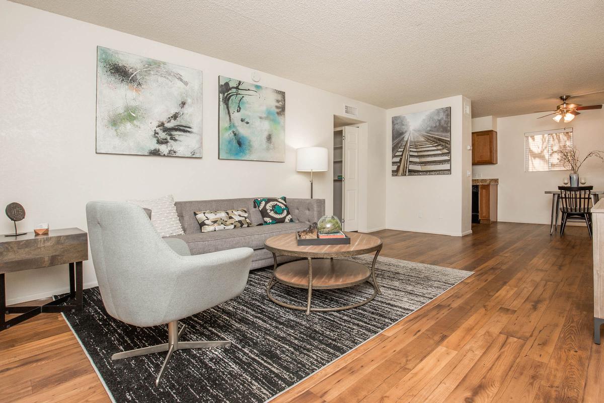 a living room filled with furniture and a fireplace