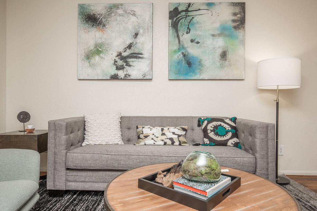 a living room with a couch and a table
