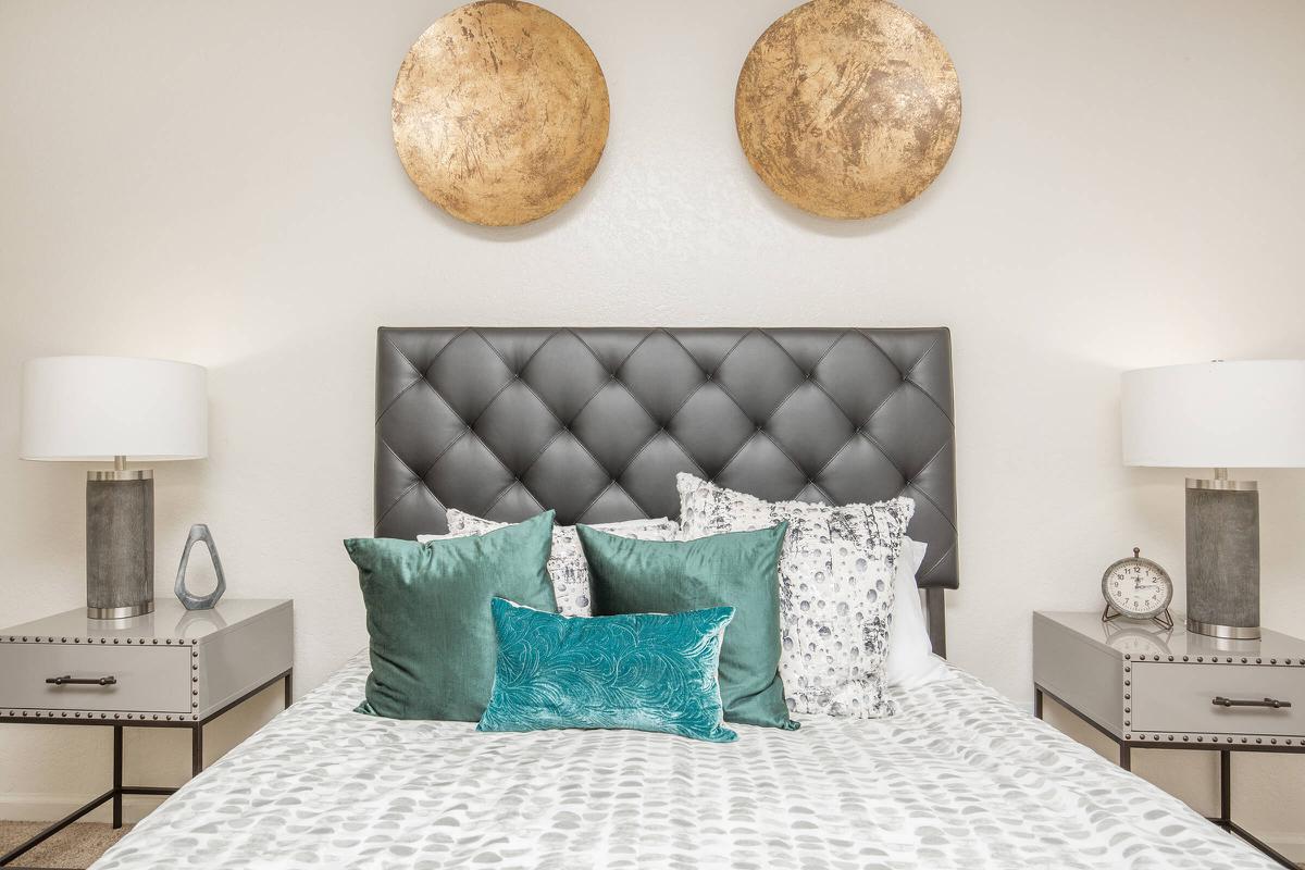 a bedroom with a bed in a room