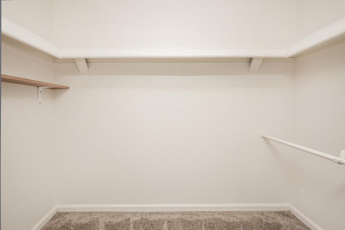 a white tub sitting next to a shower