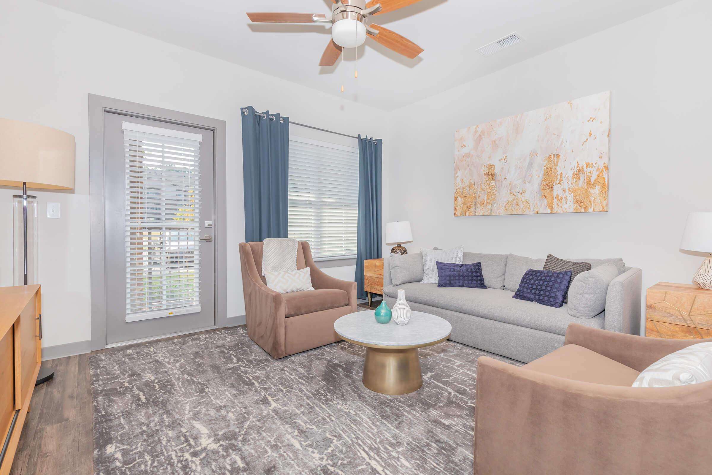 a living room filled with furniture and a fireplace
