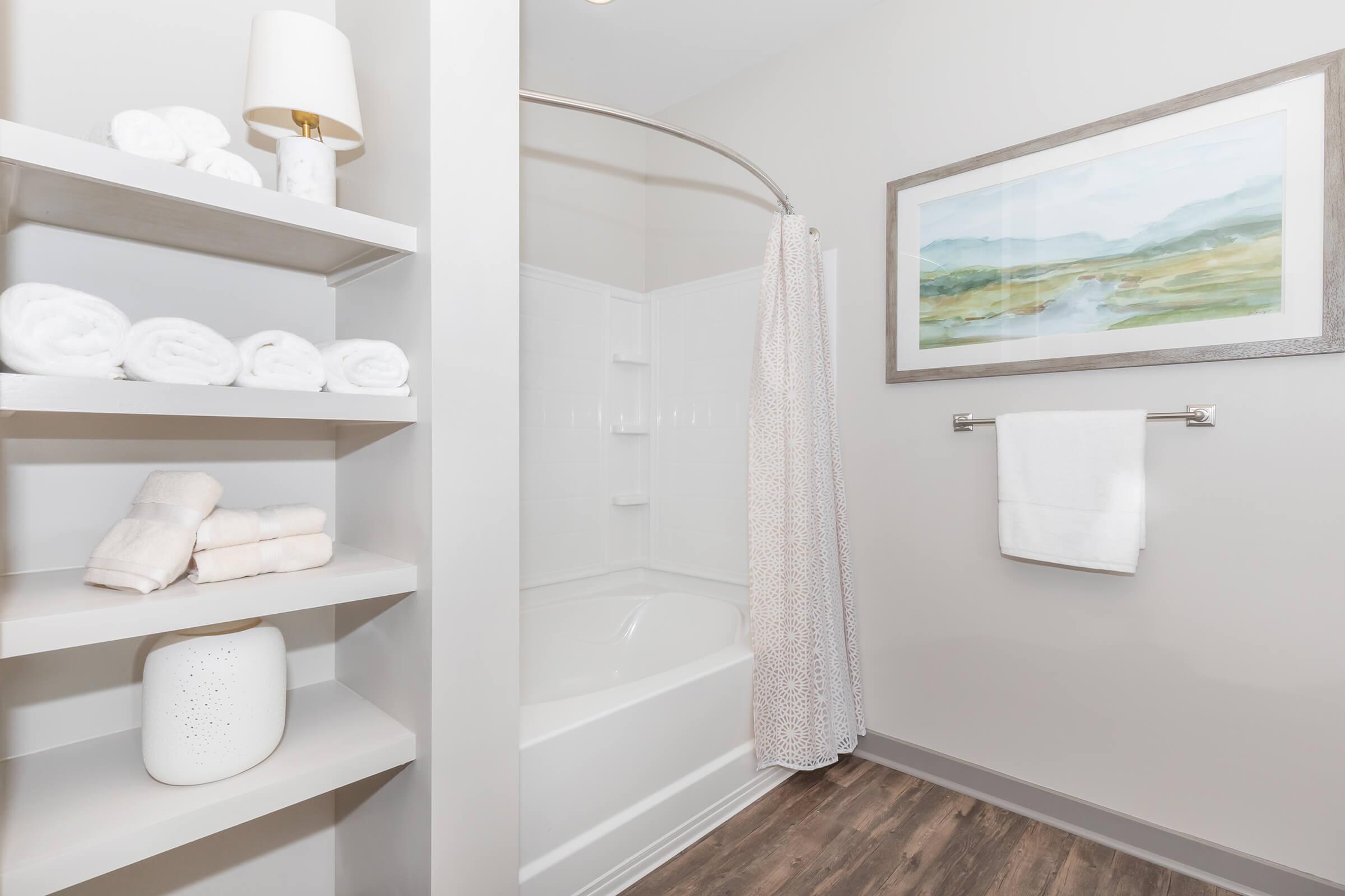 a white sink and a mirror