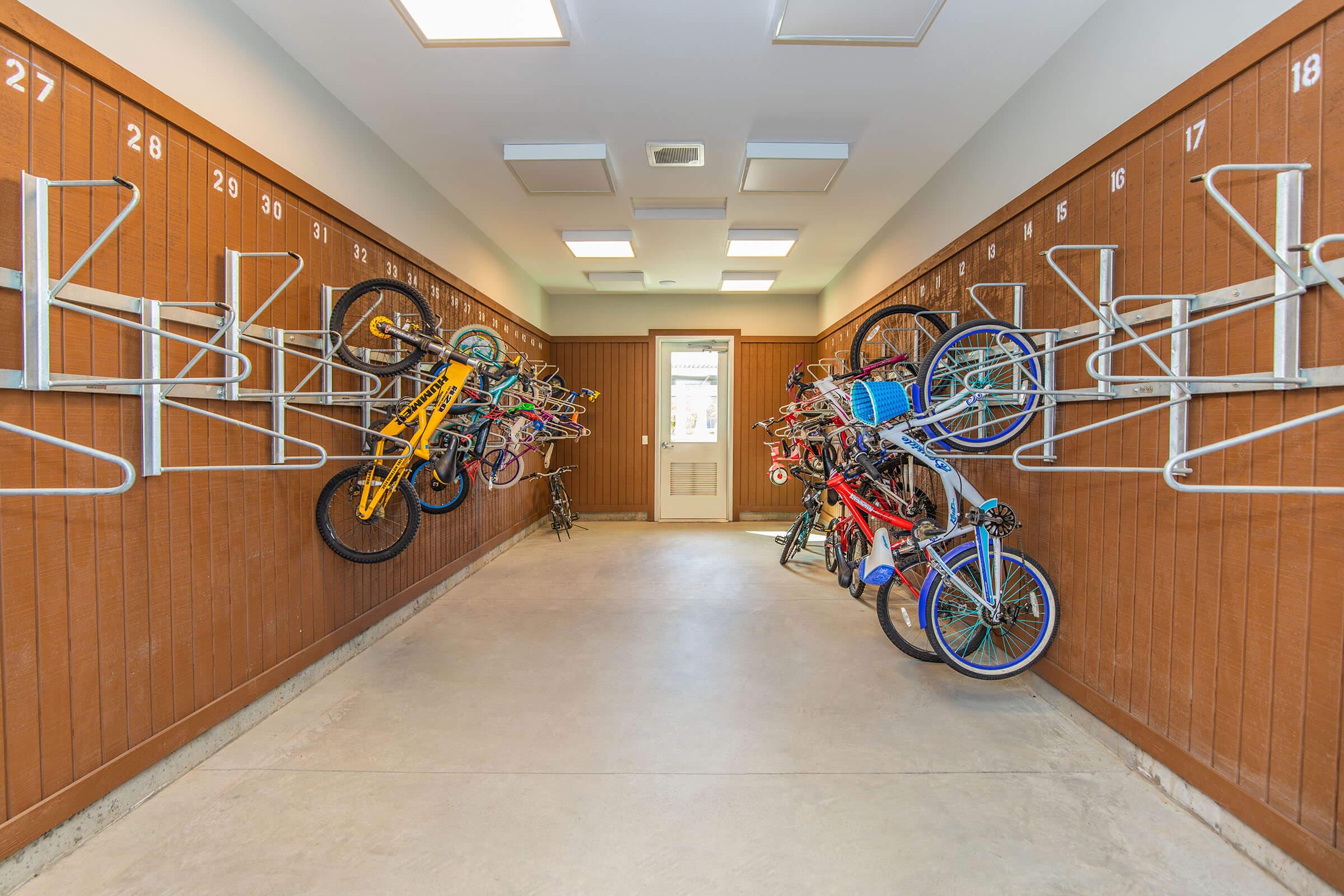 a bicycle leaning on a wooden floor