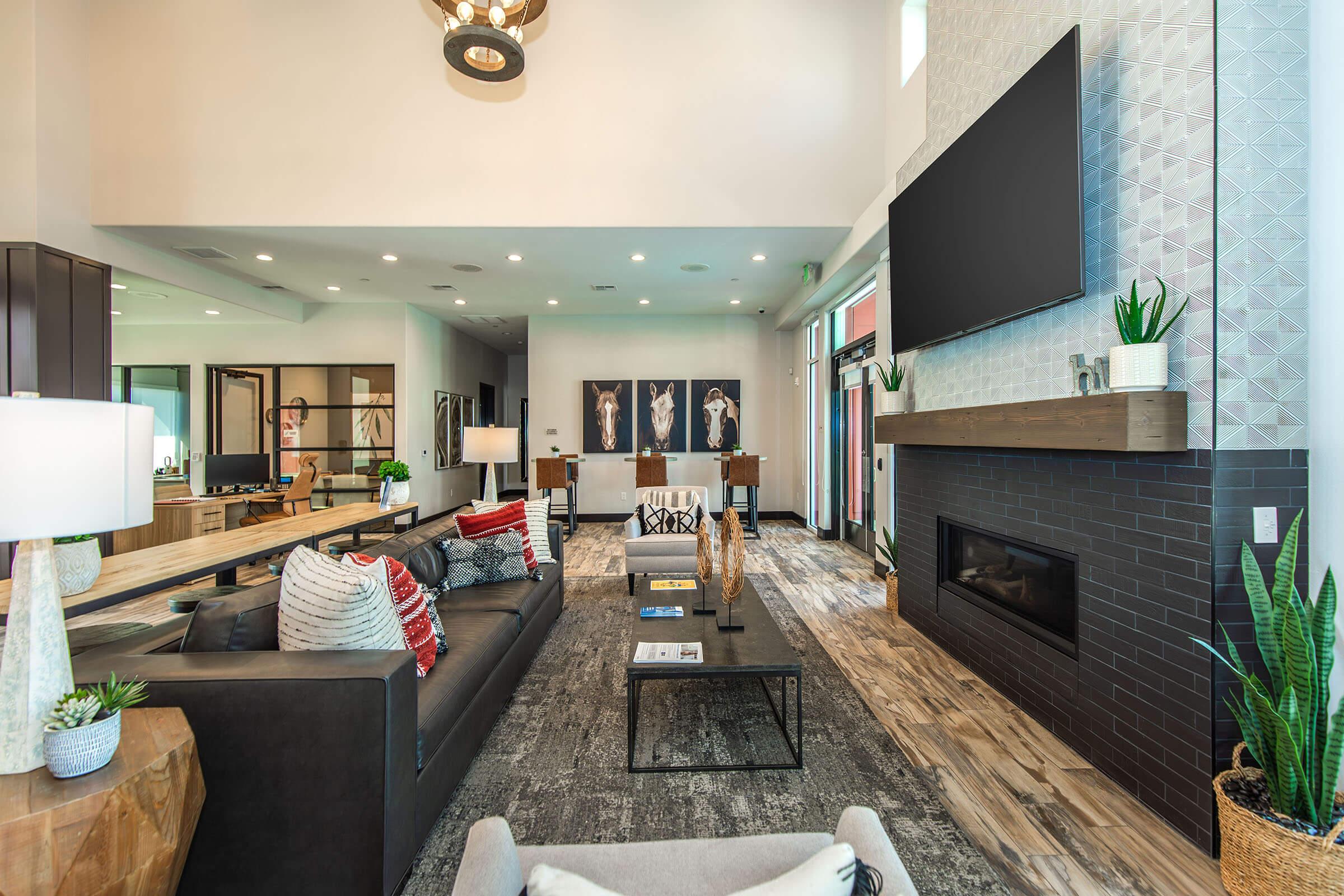 a living room filled with furniture and a fireplace