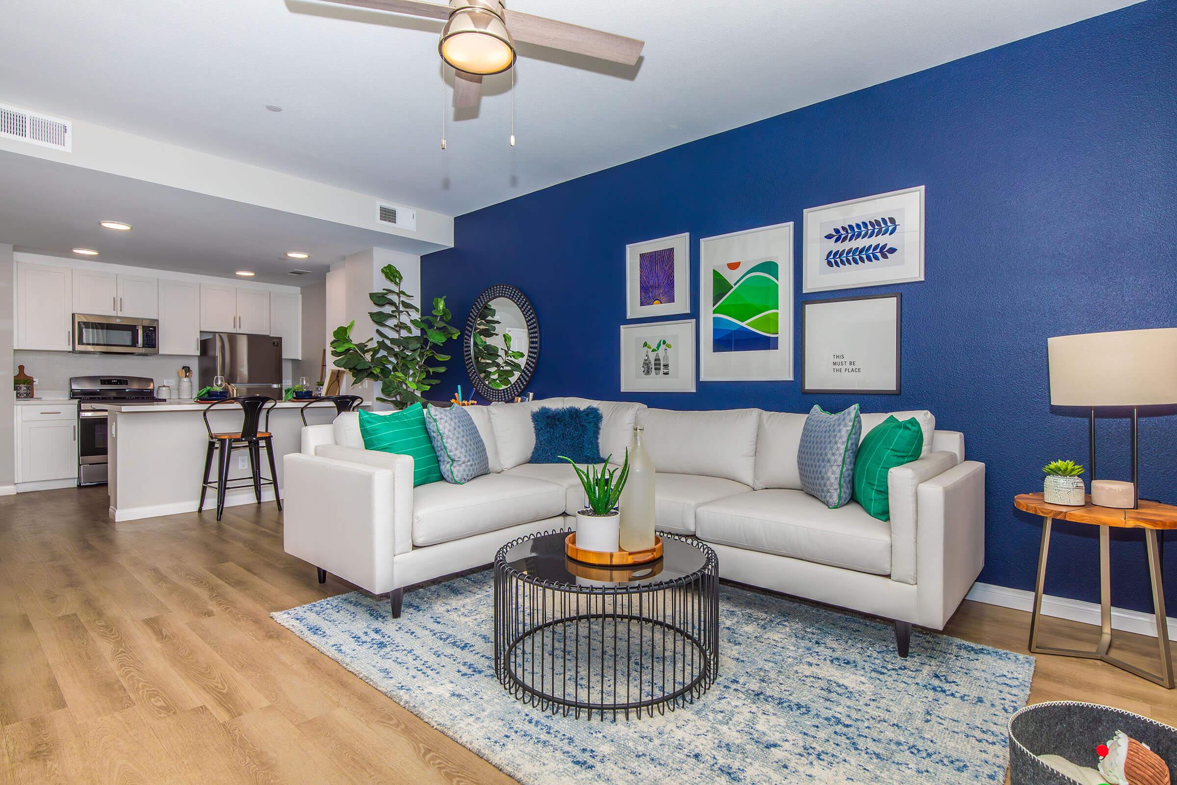 a living room filled with furniture and a flat screen tv