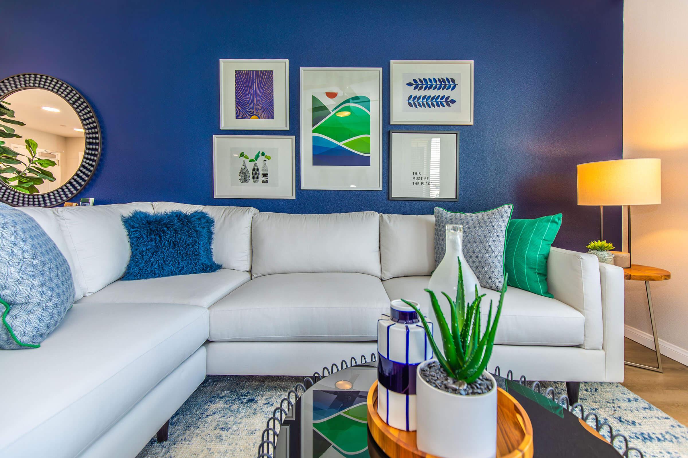 a living room filled with furniture and a table