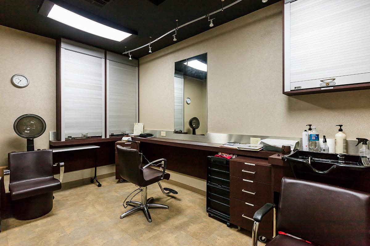 an office with a desk and chair in a room