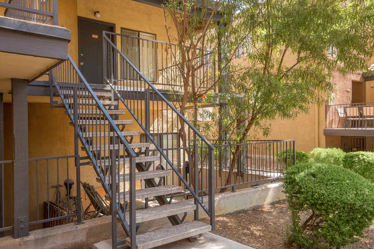 a building with a metal fence