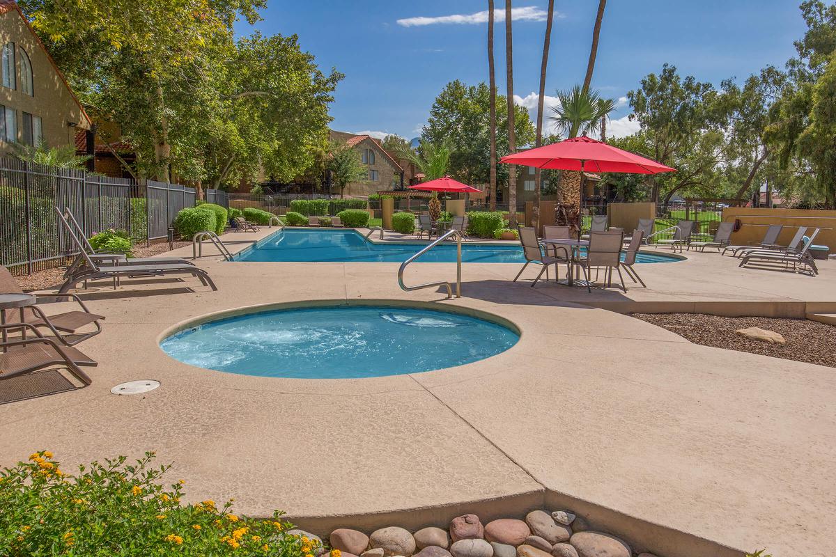 a group of lawn chairs sitting next to a pool