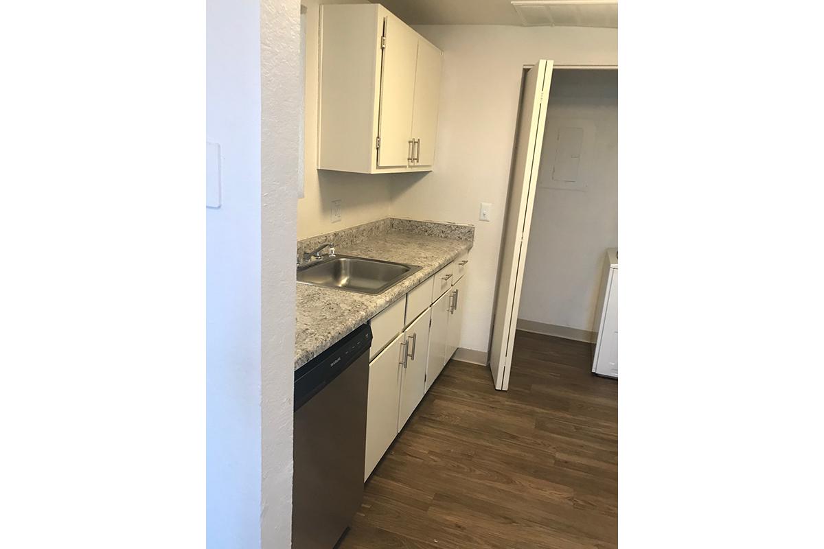 a large white refrigerator in a kitchen