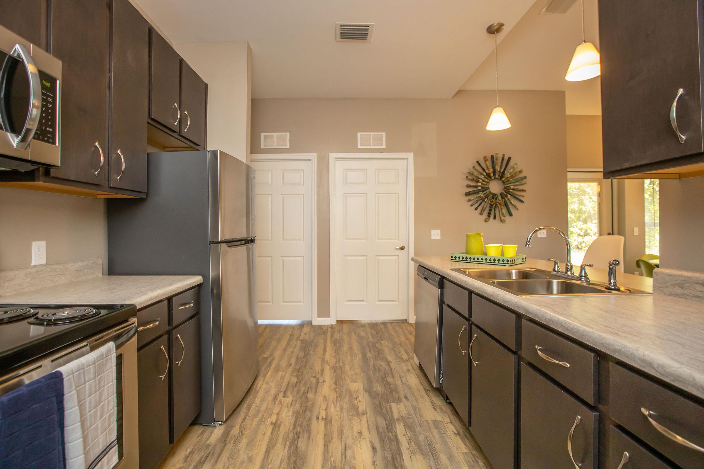 a large kitchen with stainless steel appliances