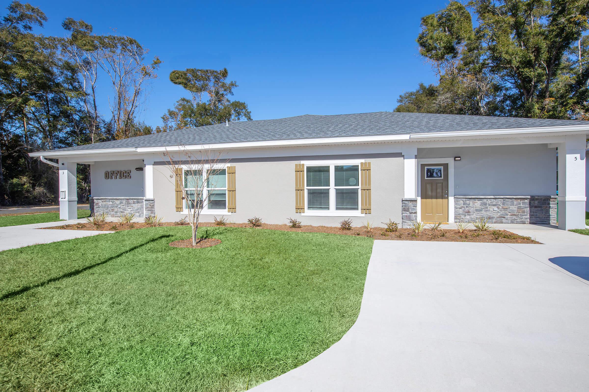 a large lawn in front of a house