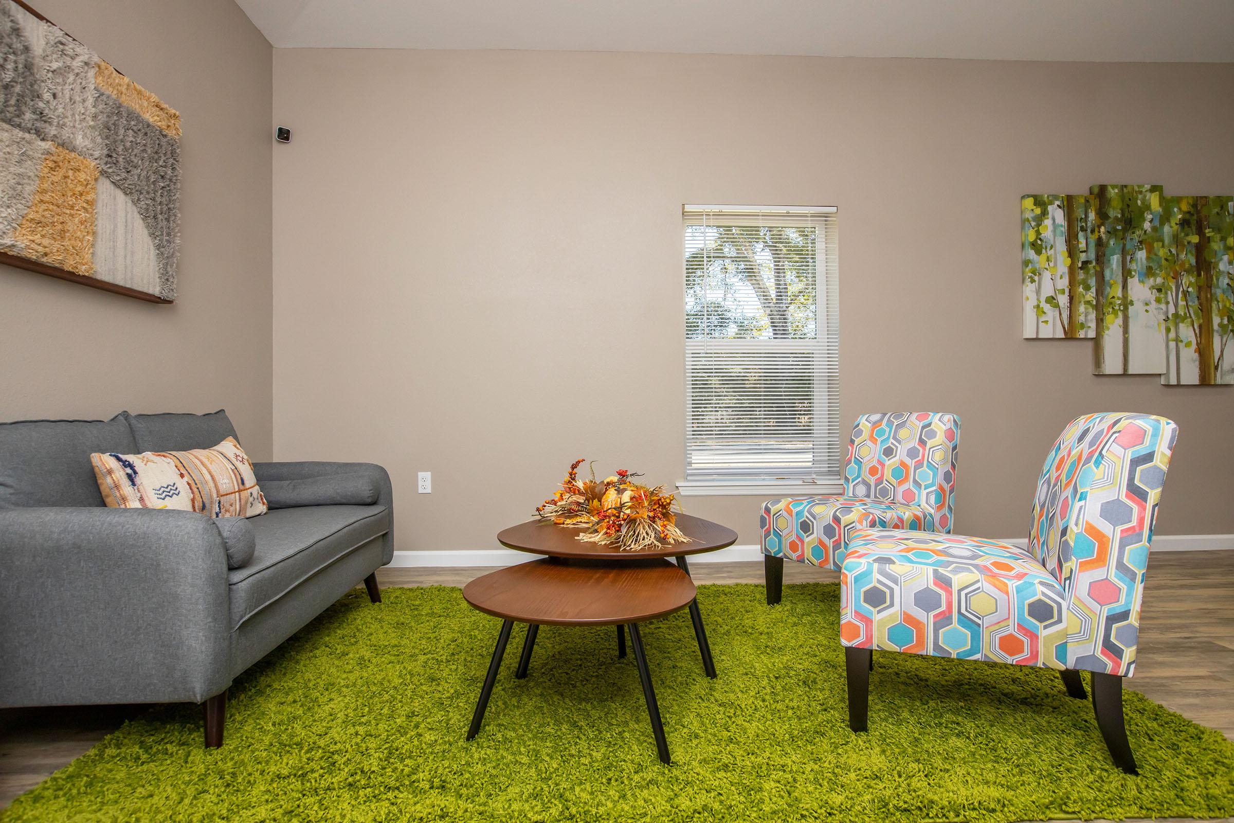 a living room filled with furniture and decor