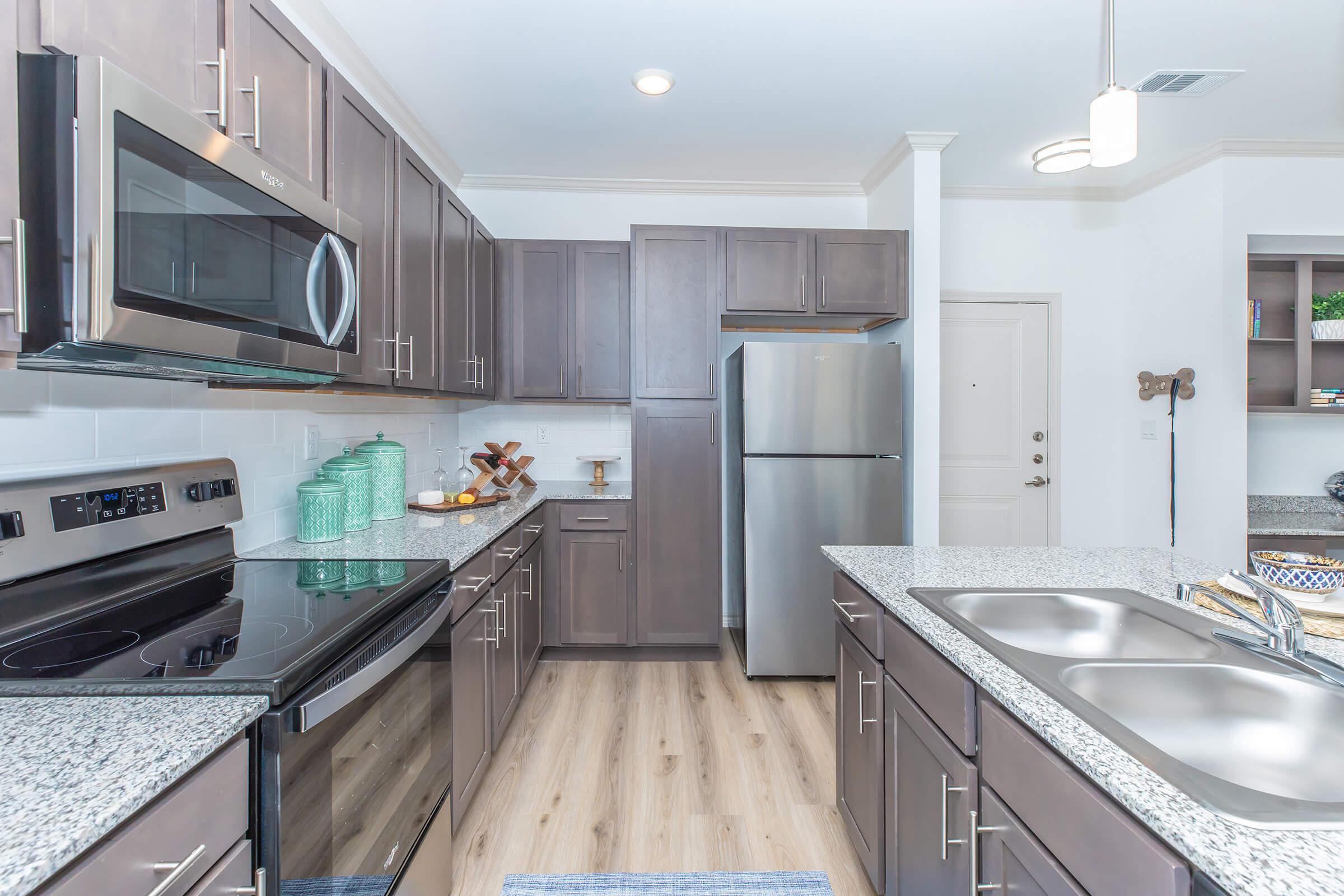 a kitchen with a stove and a sink