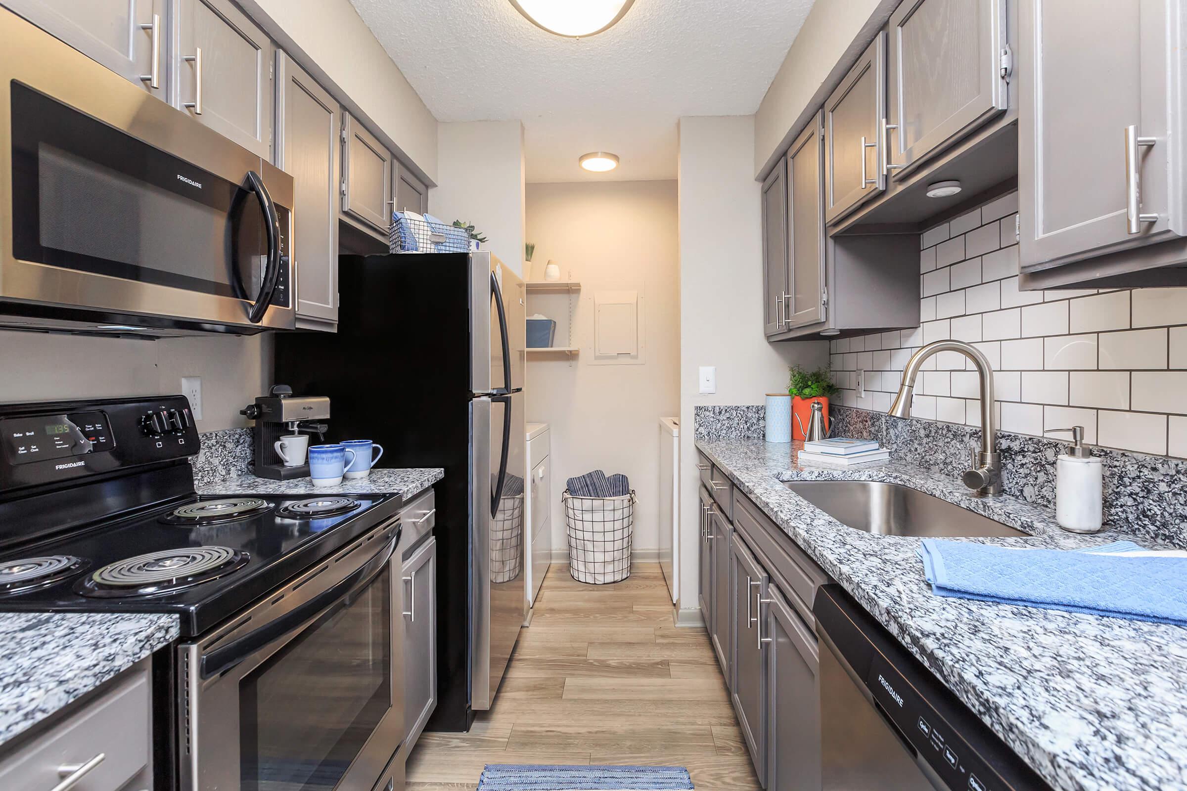 a modern kitchen with stainless steel appliances