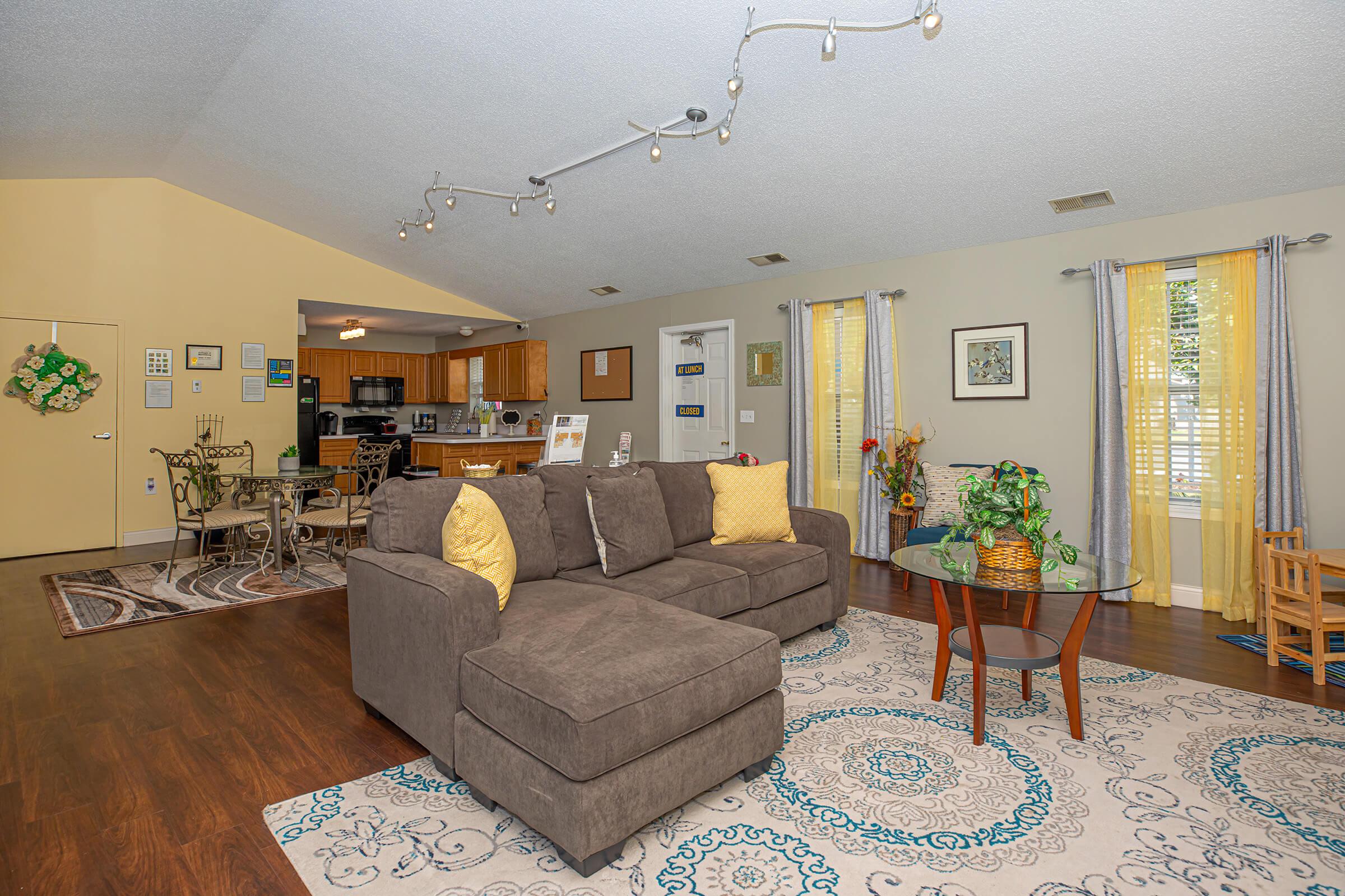 a living room filled with furniture and decor