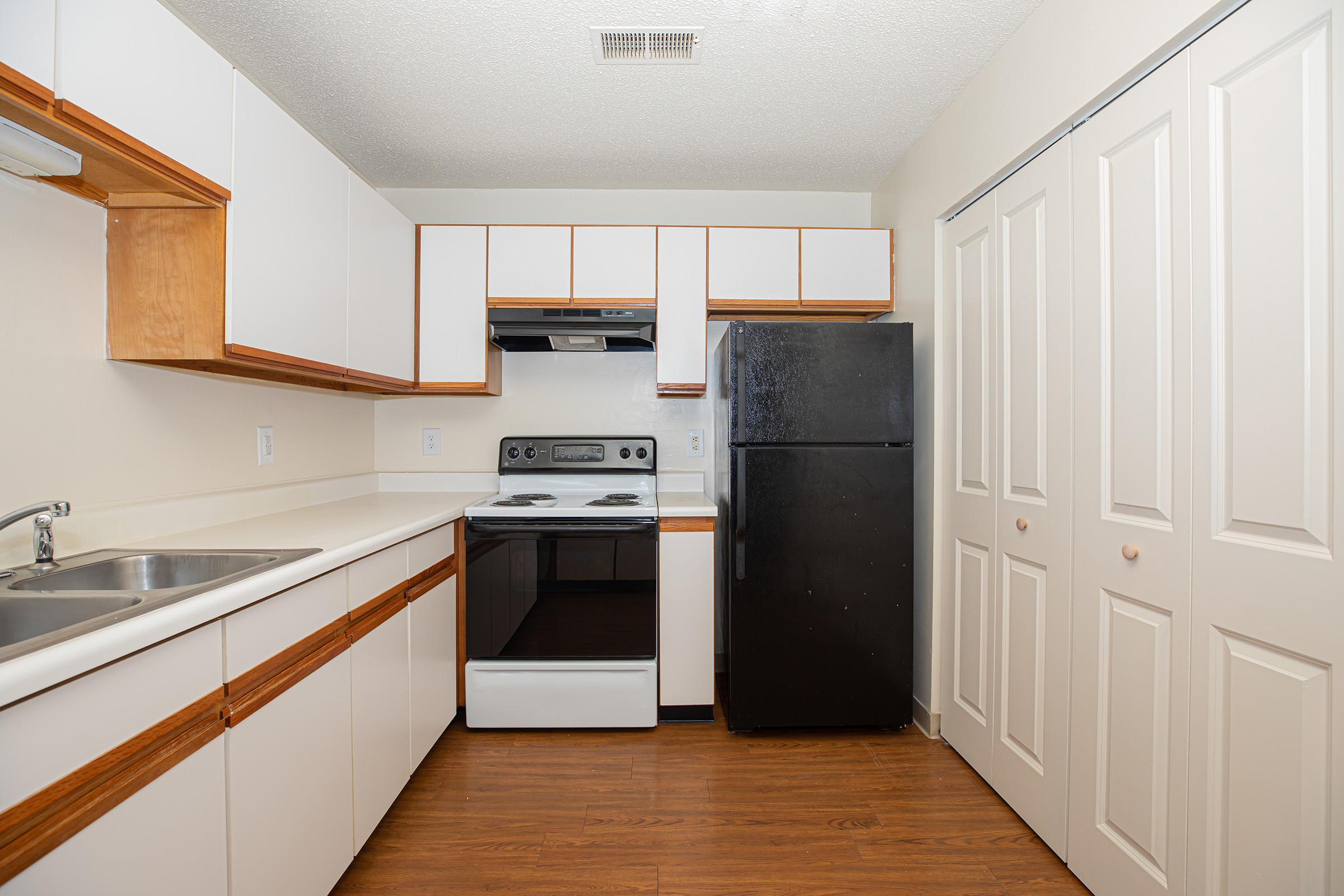 a kitchen with a sink and a microwave