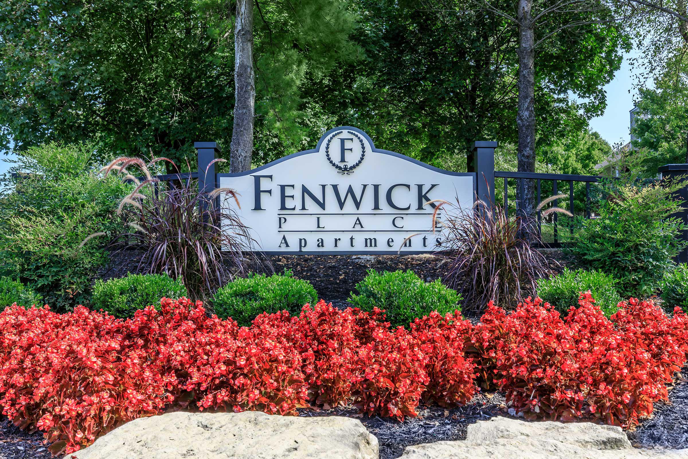 a sign in front of a tree