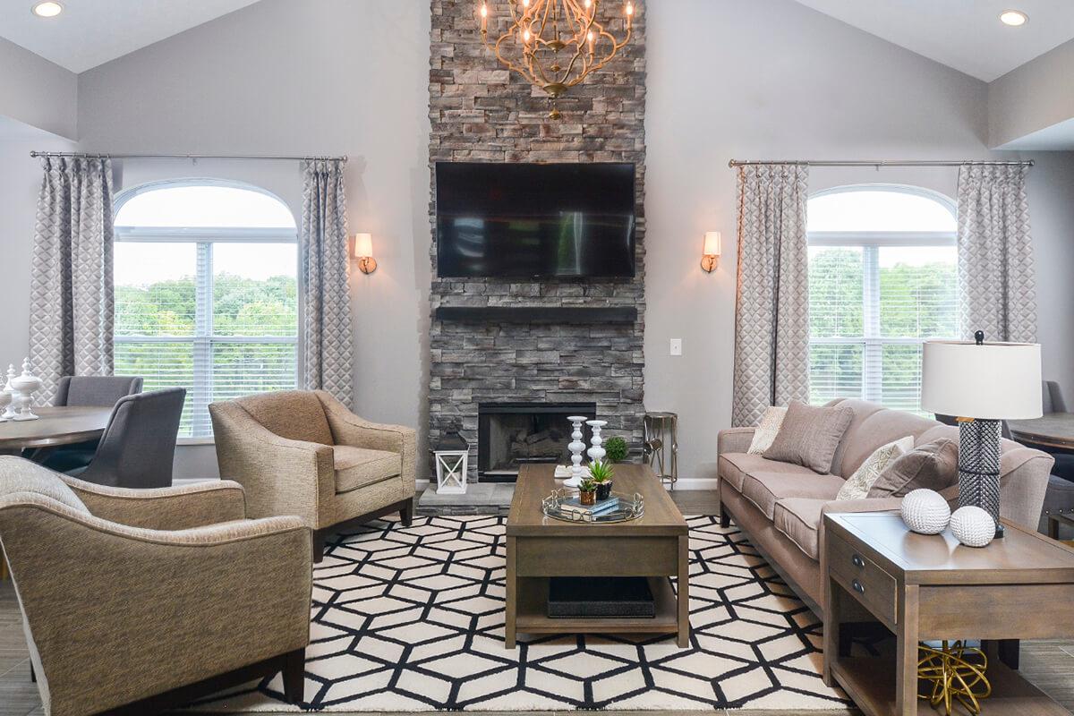 a living room filled with furniture and a fire place