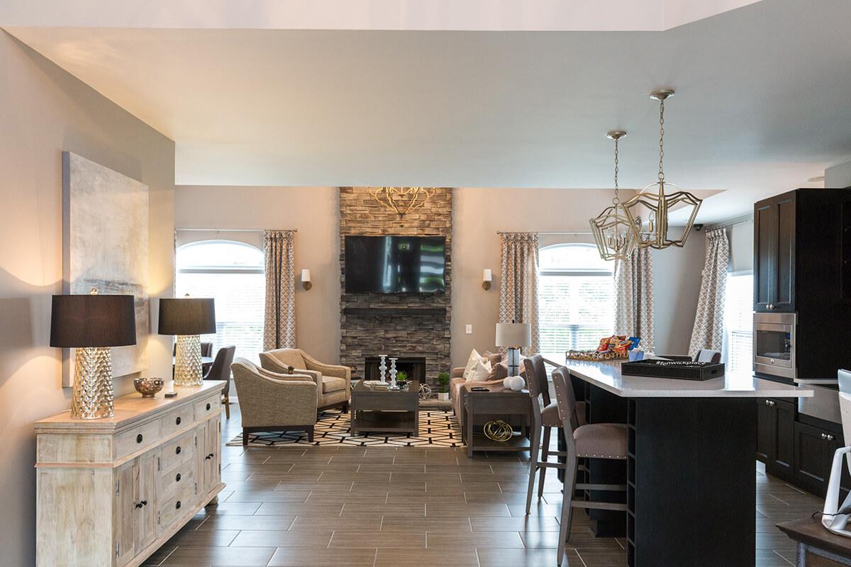 a living room filled with furniture and a large window