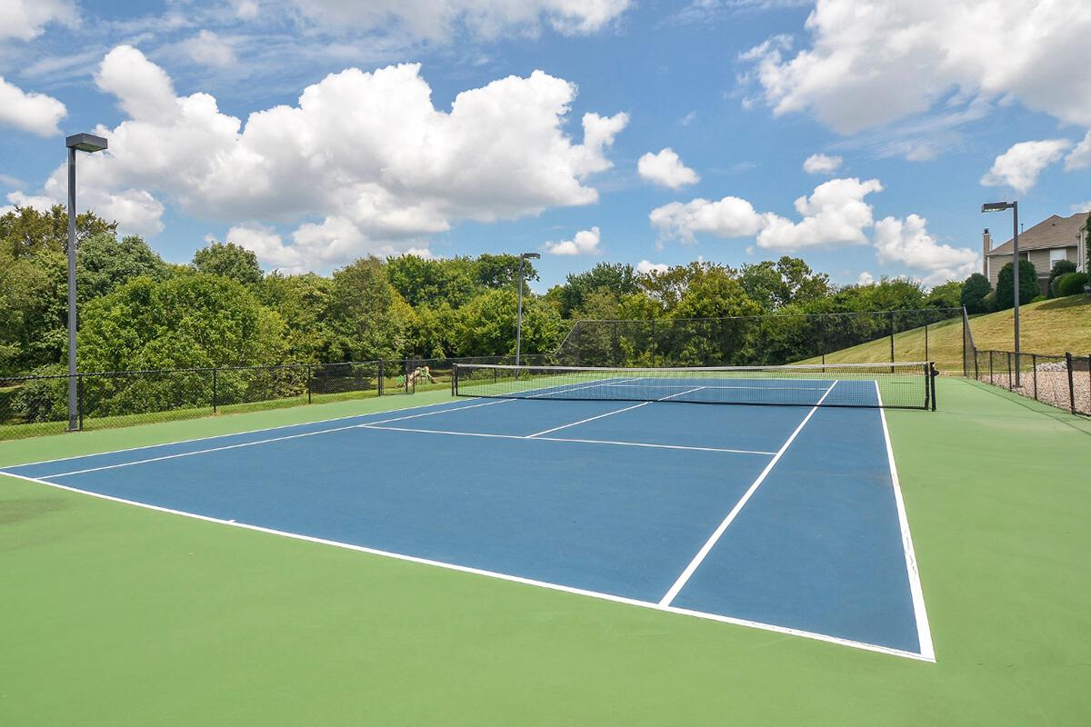 a person on a court with a racket